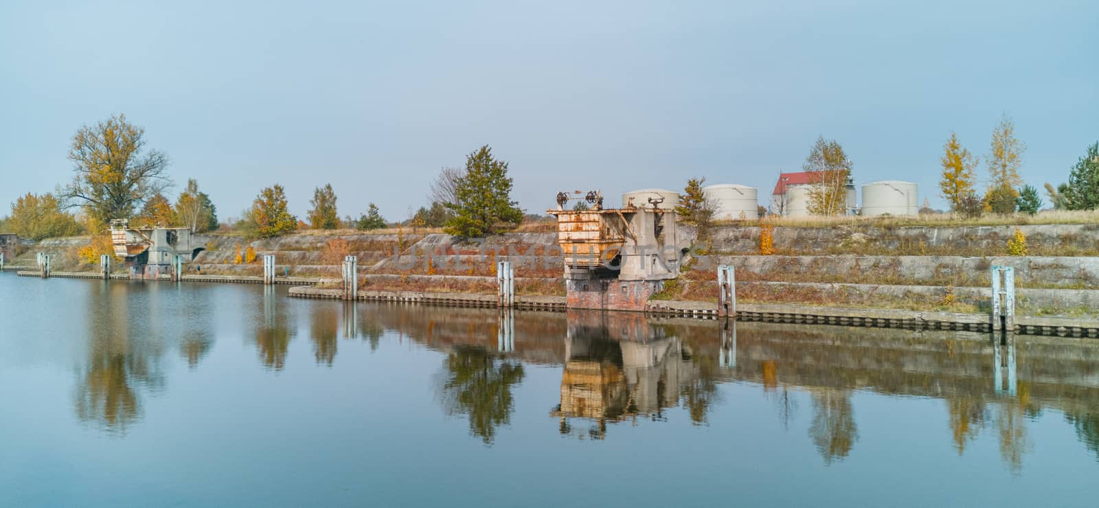 Old city port reflected in water