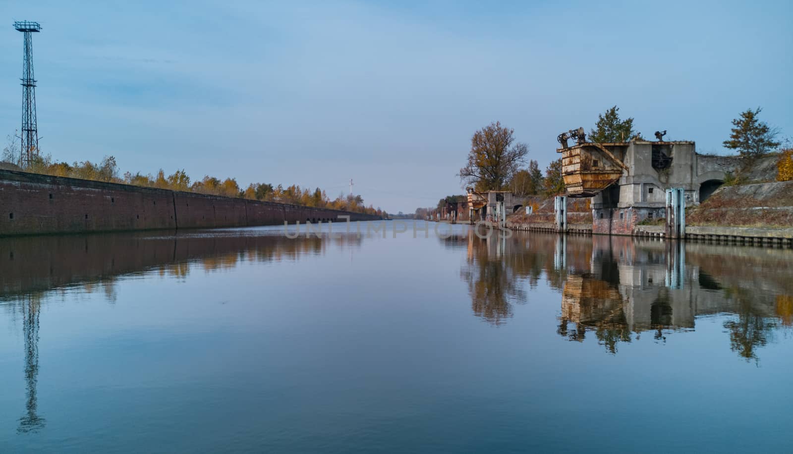 Old city port reflected in water