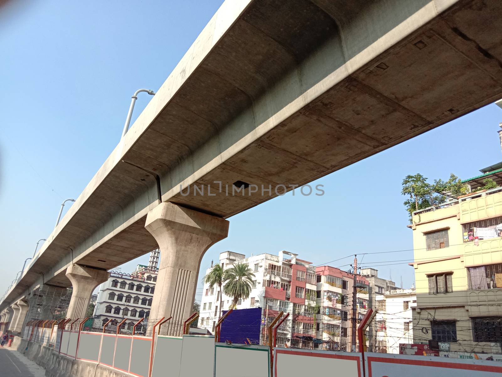 metro rail bridge closeup on city with building