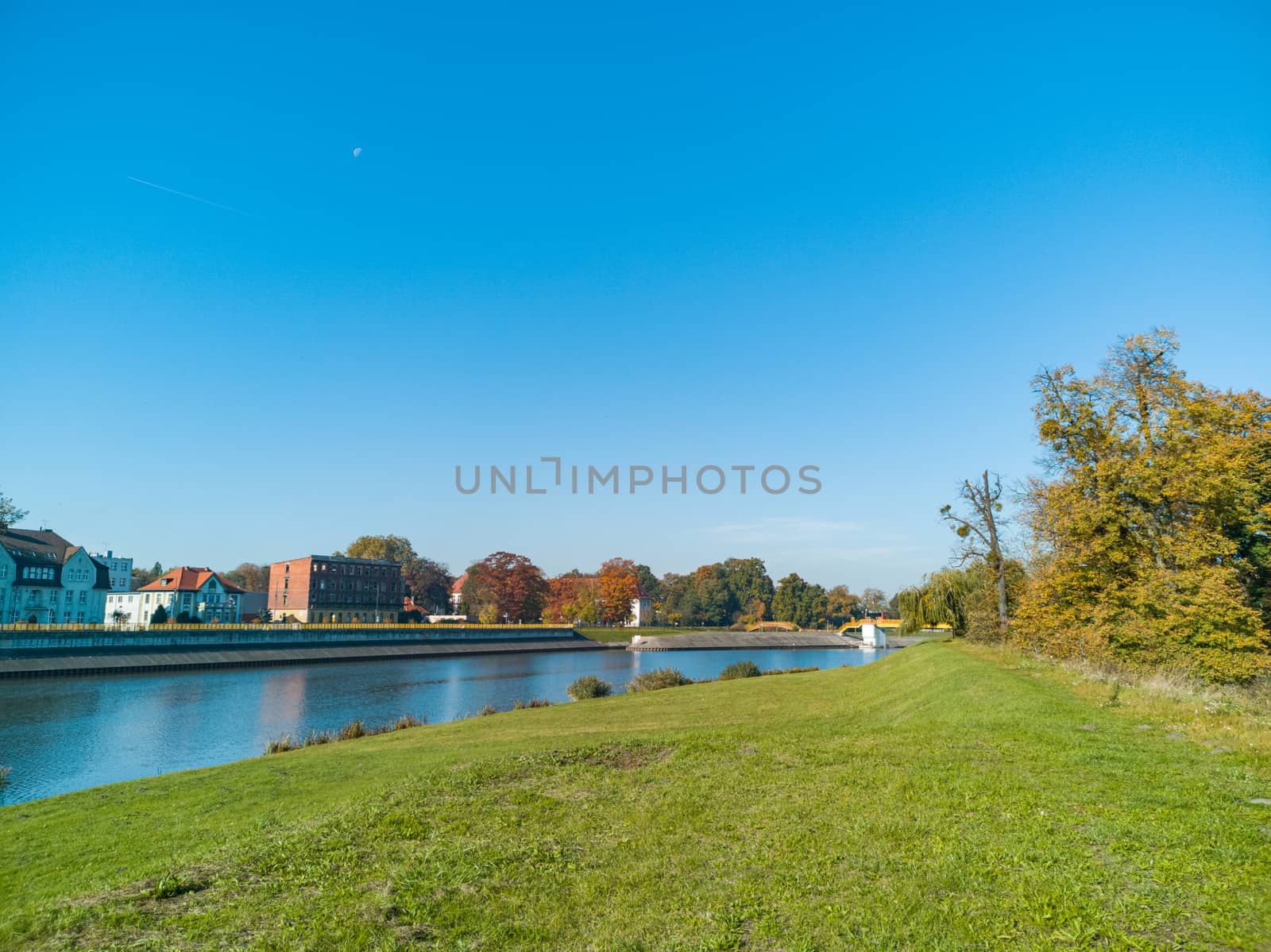 Colorful city fall landscape with buildings and river by Wierzchu