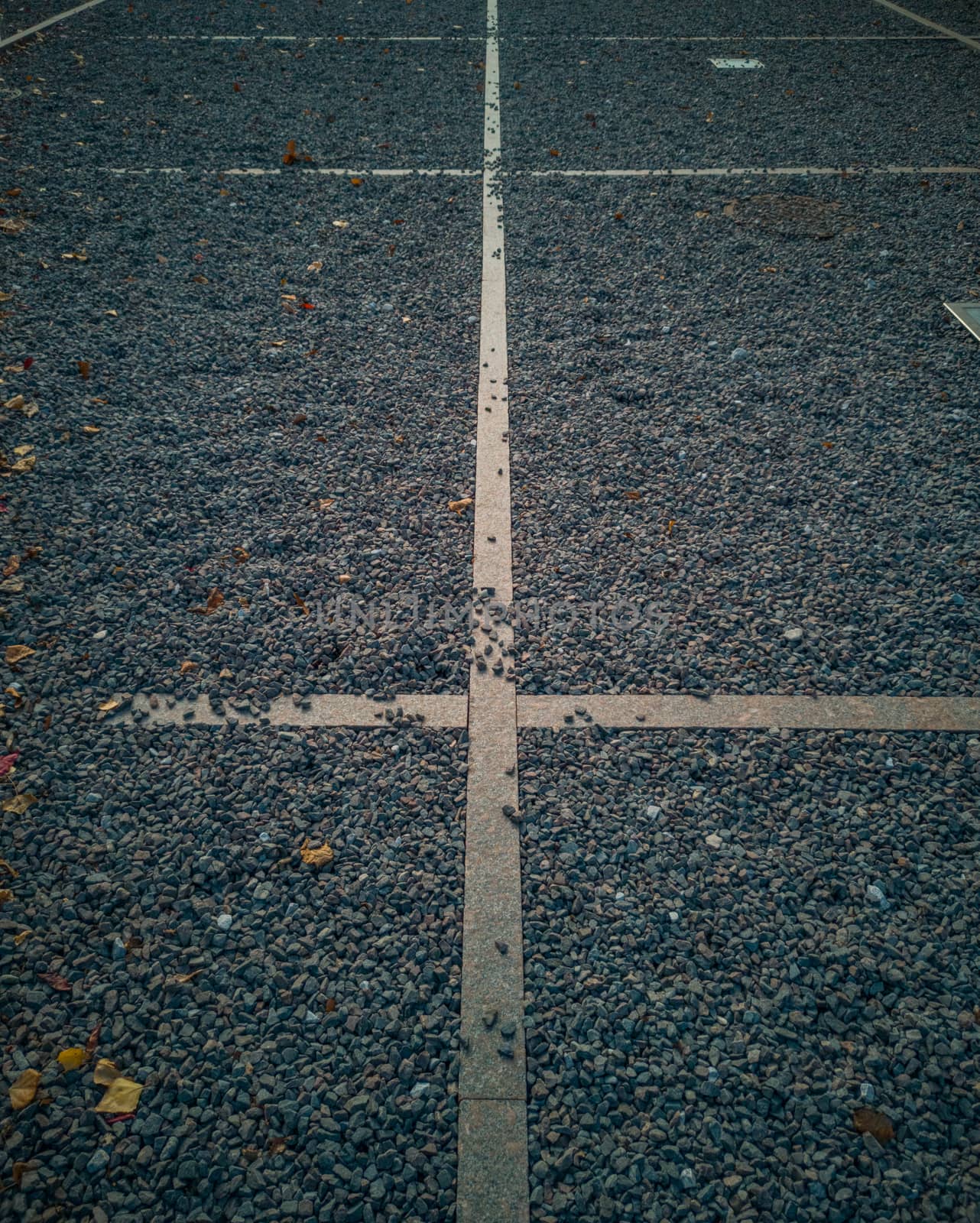 Concrete lines between holes with small stones