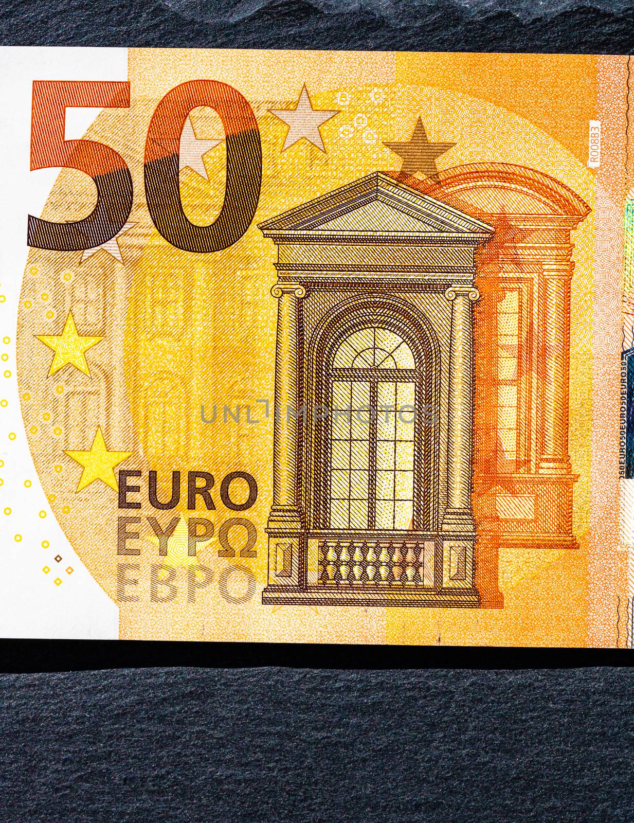 Selective focus on detail of euro banknotes. Close up macro deta by vladispas