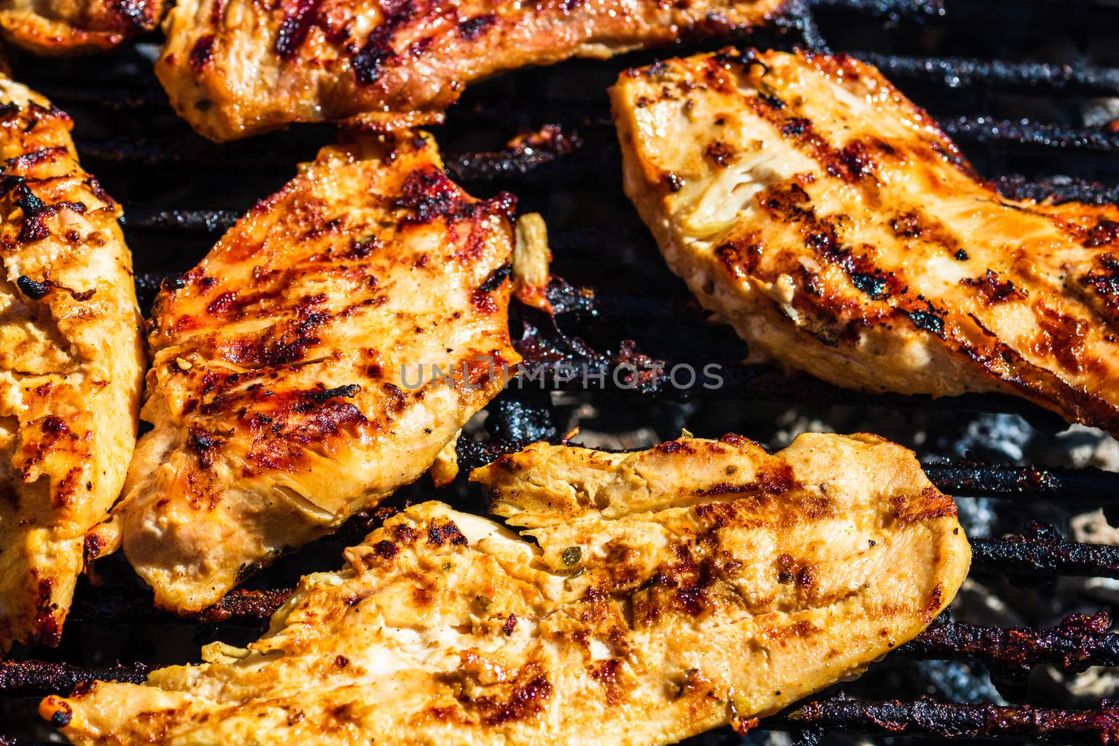 Chicken and pork steak grilled on a charcoal barbeque. Top view  by vladispas