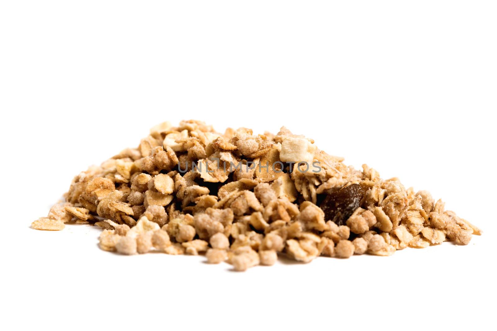 pile of muesli isolated on white background by galinasharapova