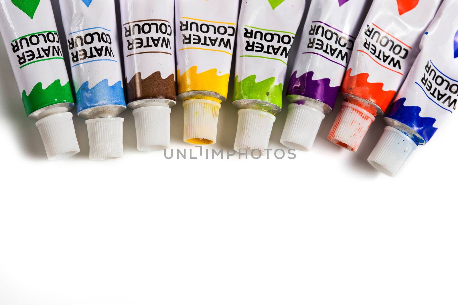 Dried watercolor paints in tubes isolated on white background by galinasharapova