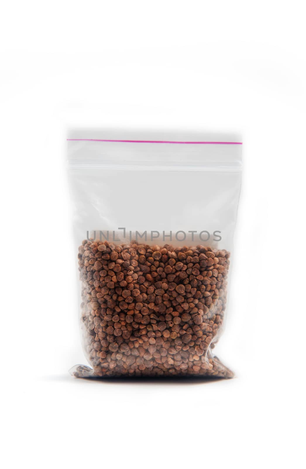 Chinese radish seeds in a package for germination on a white background.