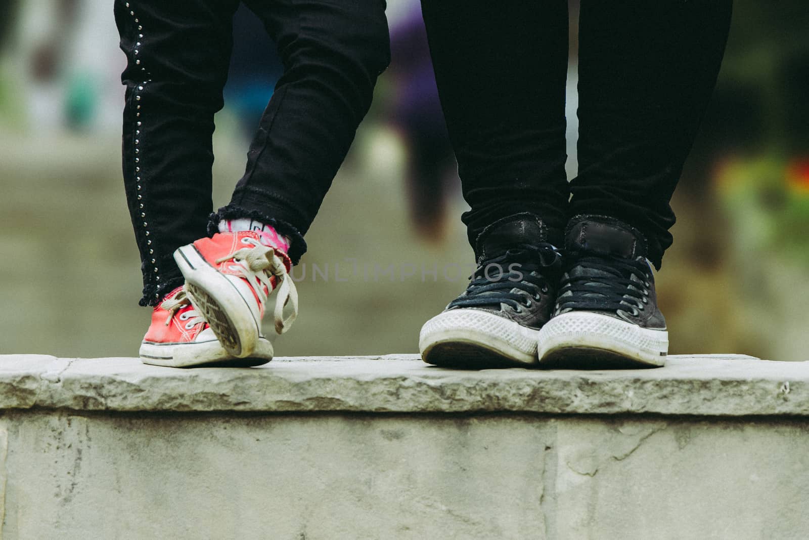Cropped image of mother and daughter, mom and daughter slippers