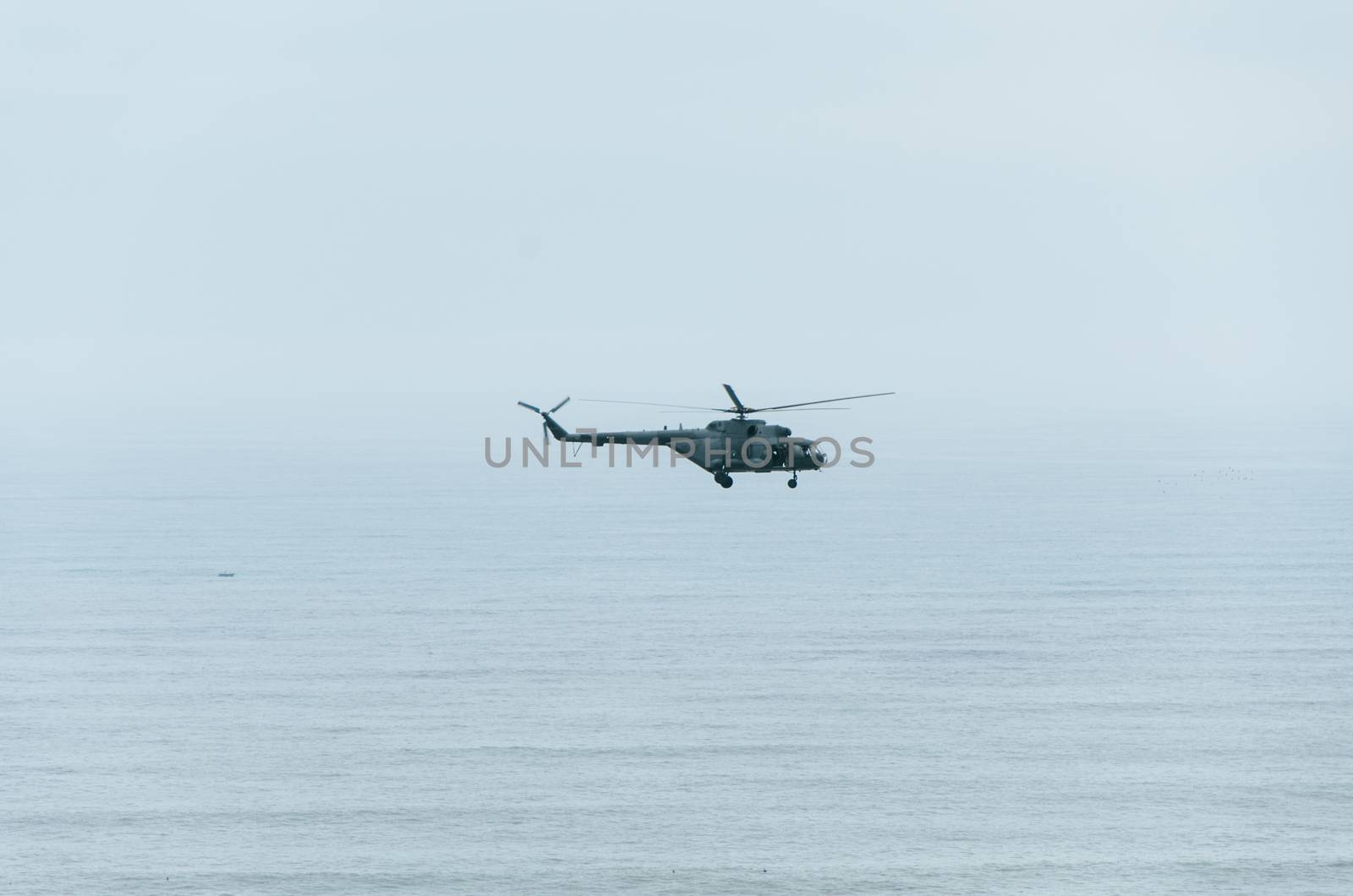 Helicopter in the air over the sea