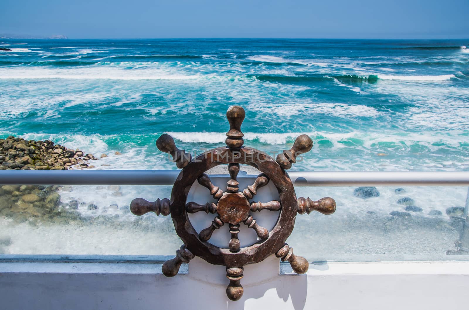 Beautiful view of the sea from a house on the beach with a helm of a pirate ship
