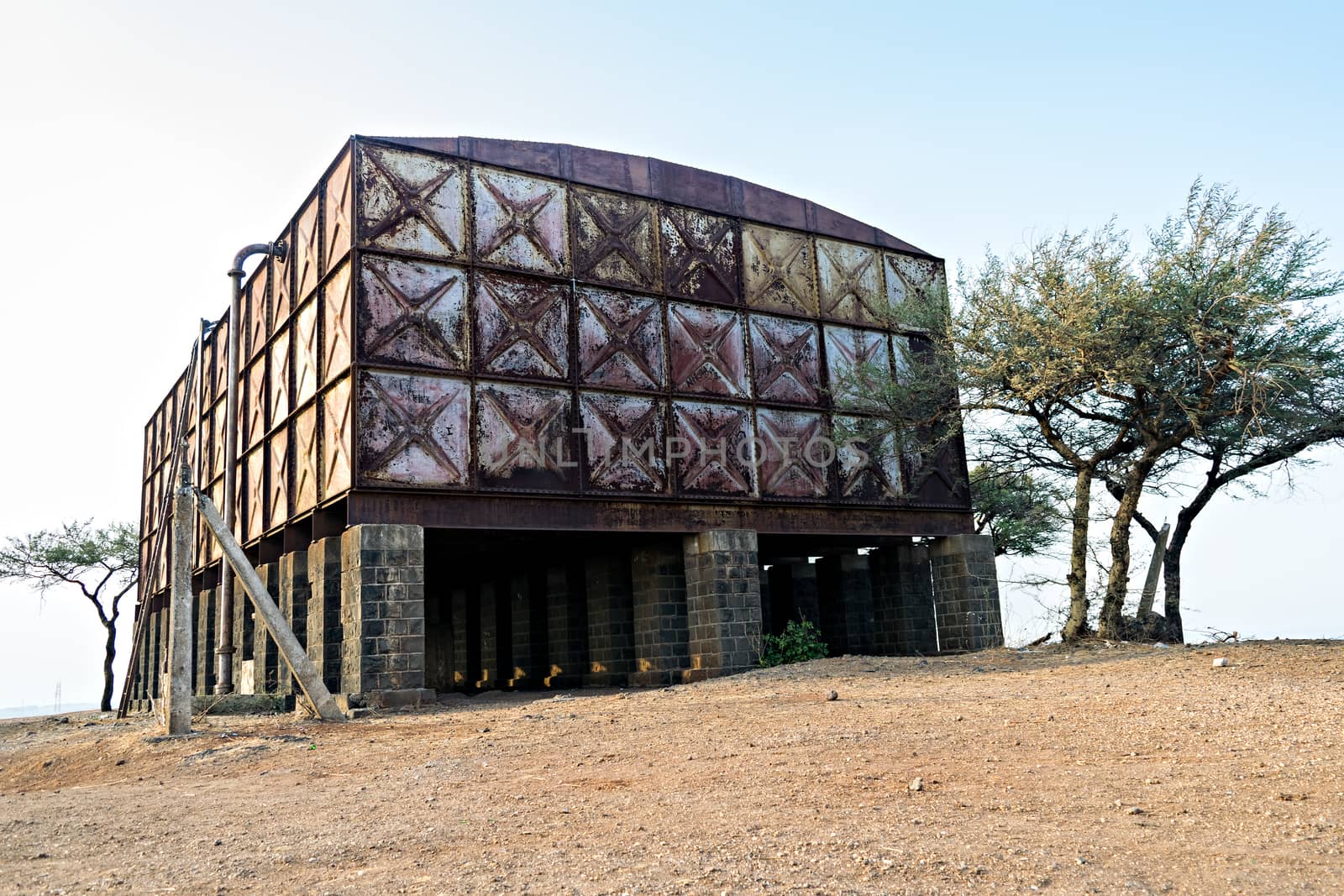 Abandoned, old water tank on a hill in Dighi, Pune made of steel plates belonging to Appleby-Frodingham England