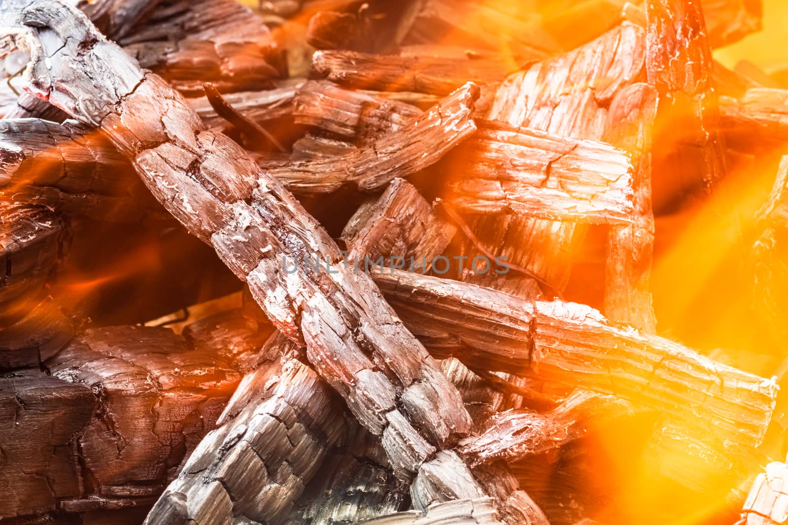 Burning wood chips forming coal. Barbecue preparation, fire befo by vladispas