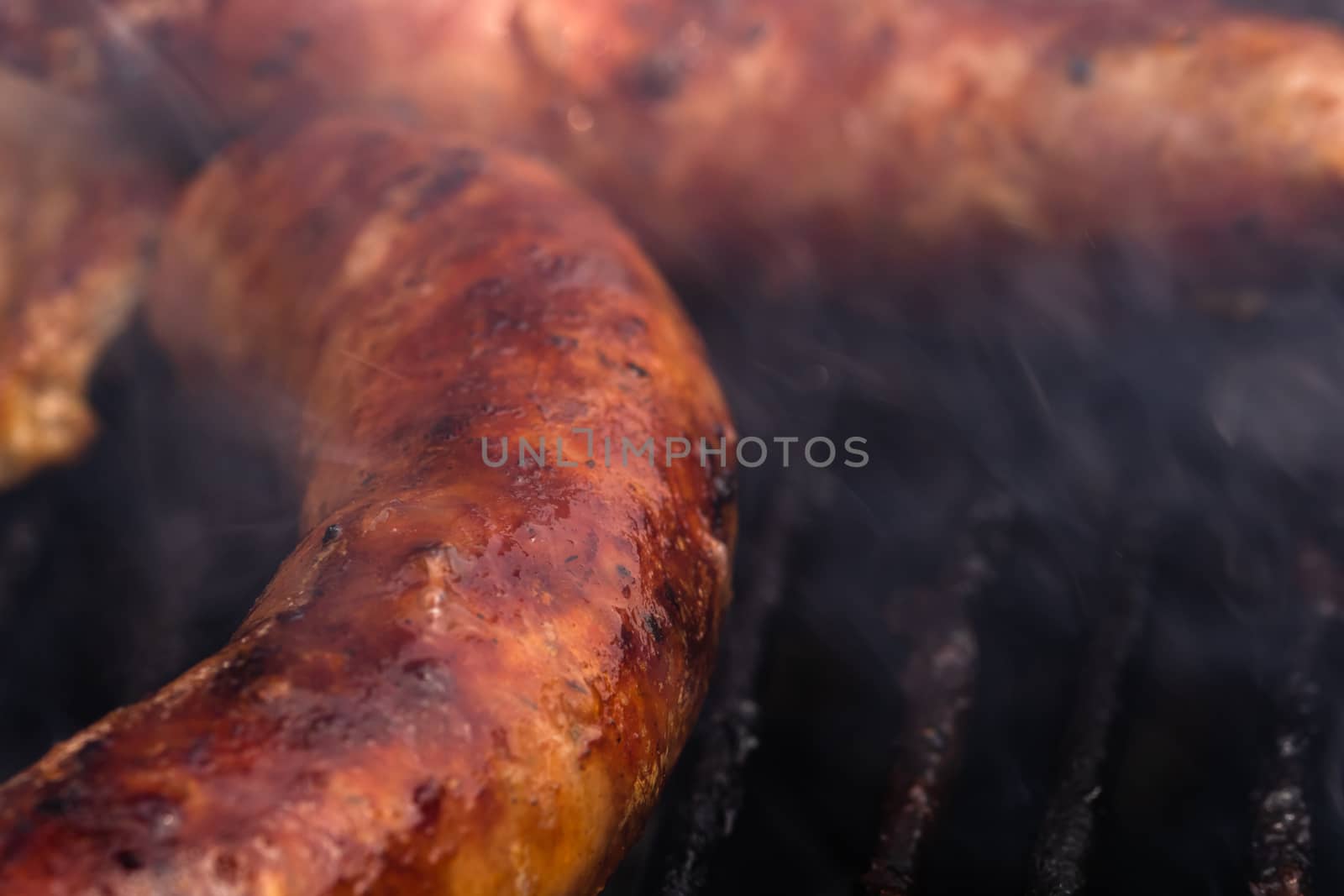 Close up on details of homemade sausages on barbecue grill. Barb by vladispas