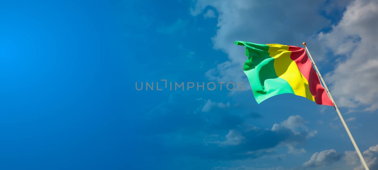 Beautiful national state flag of Guinea with blank space on wide background with place for text 3D artwork.