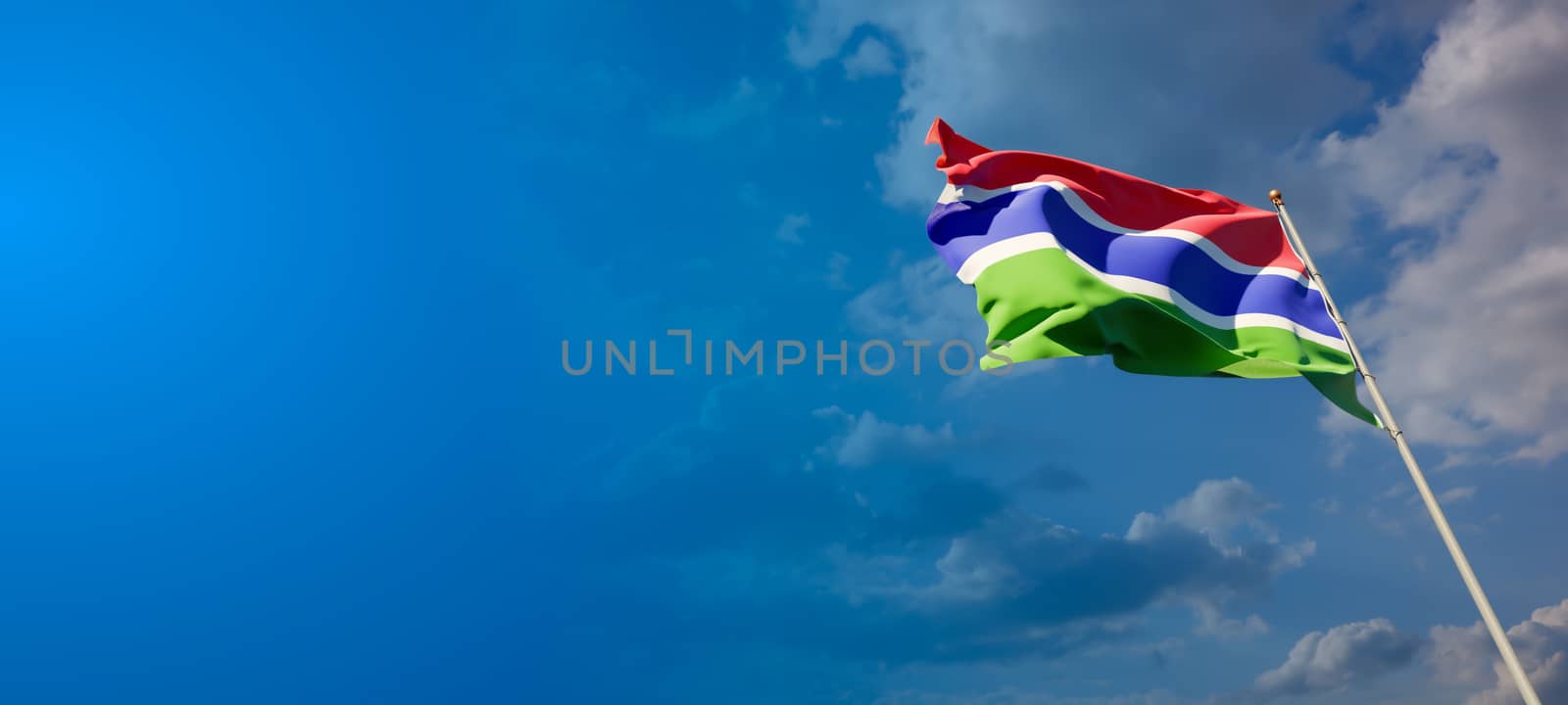 Gambia national flag with blank text space on wide background. by altman