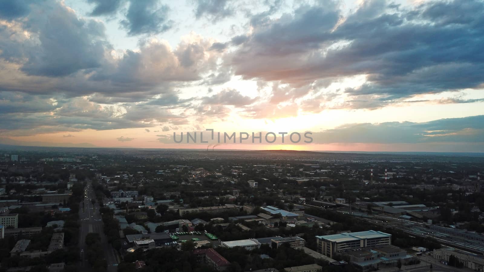 Bright color sunset over the city of Almaty. by Passcal