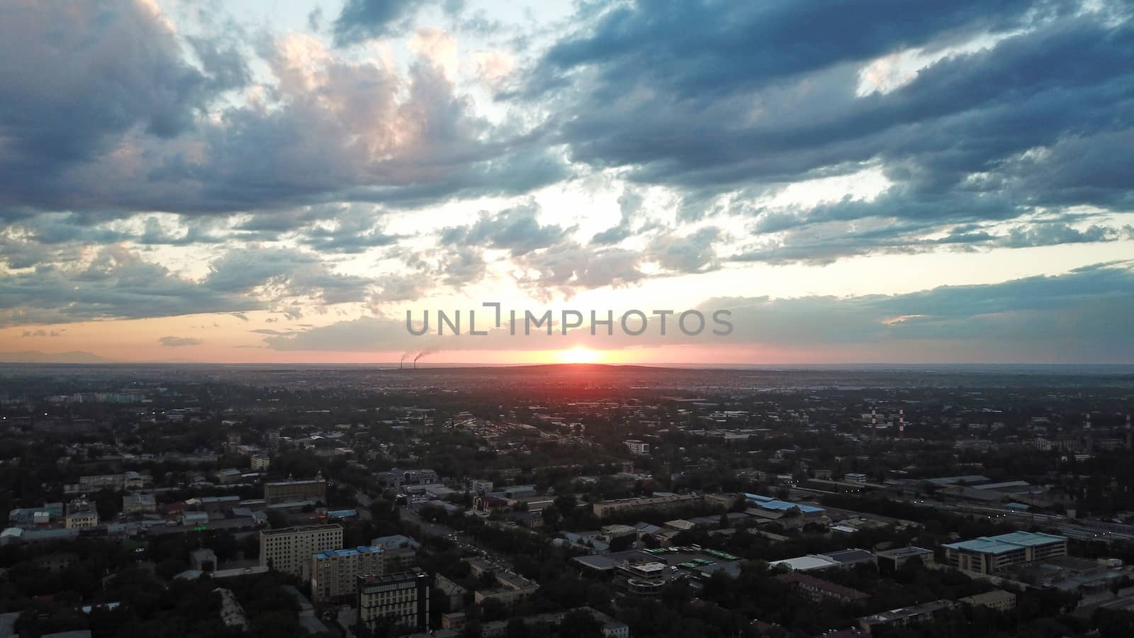 Red sunset over the city of Almaty. by Passcal
