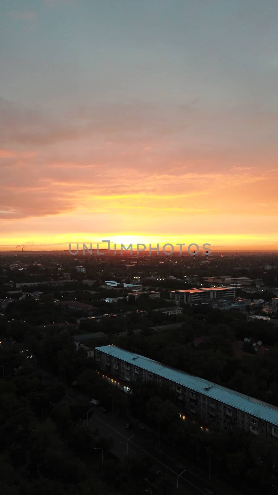 Red sunset over the city of Almaty. by Passcal