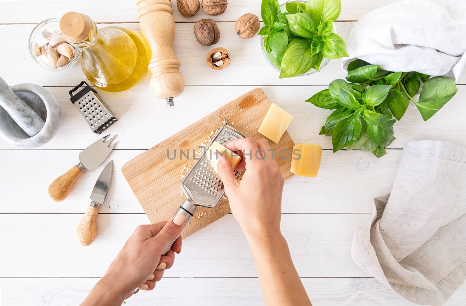 Italian Cuisine. Step by step cooking italian pesto sauce. Step 3 - grating parmesan cheese