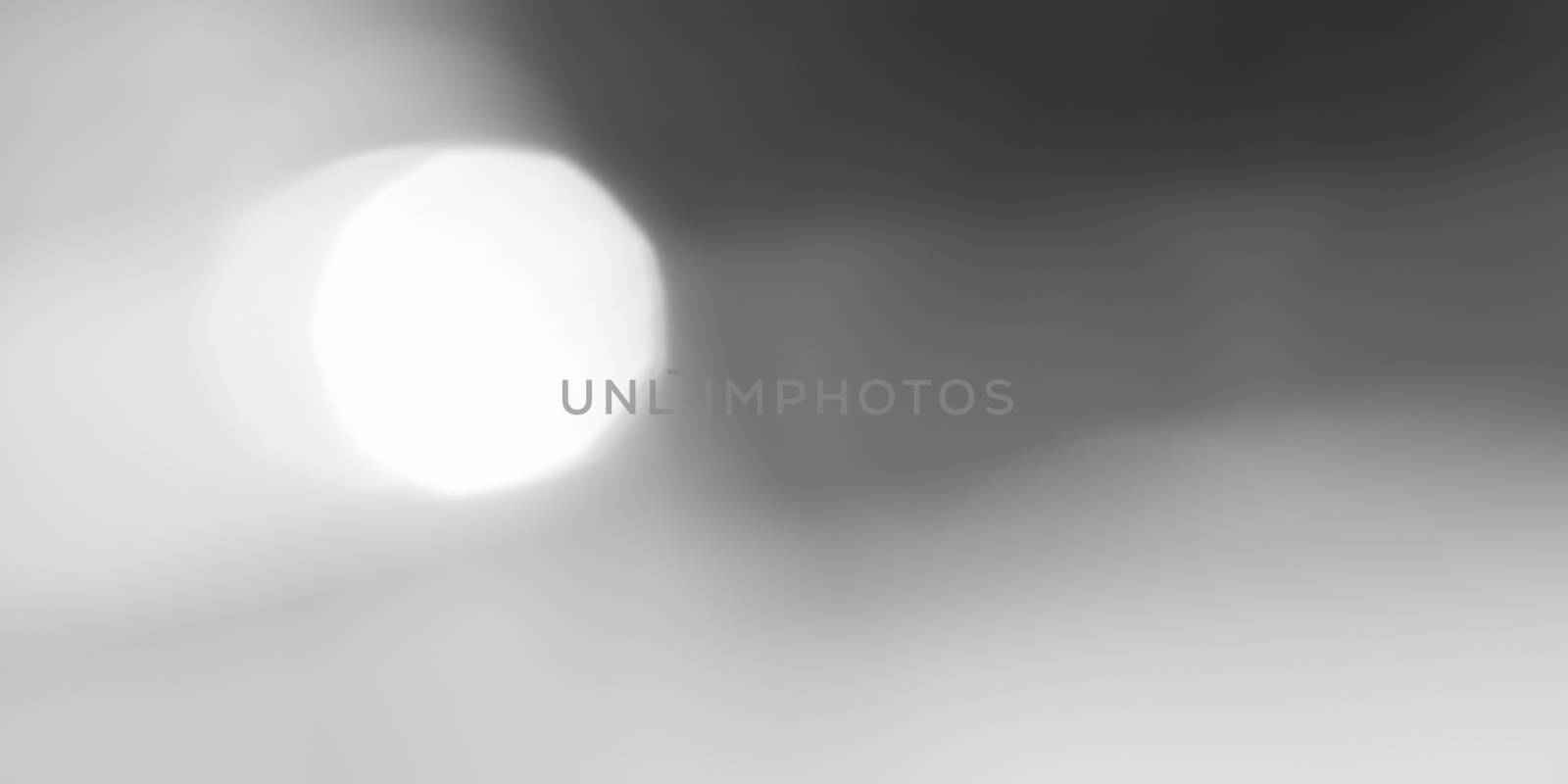 Abstract black and white bokeh background, defocused light