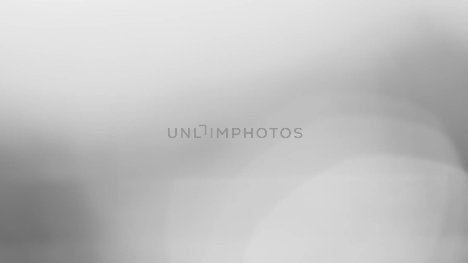 Abstract black and white bokeh background, defocused light, grey gradient