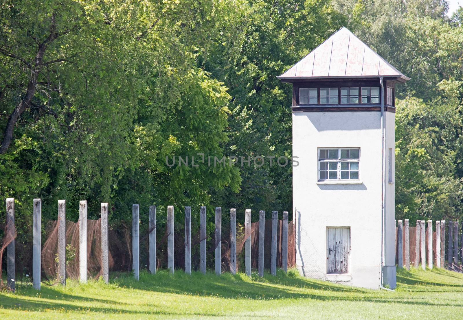 Dachau, Germany - July 13, 2020: Single watch tower at Dachau Concentration camp, Germany