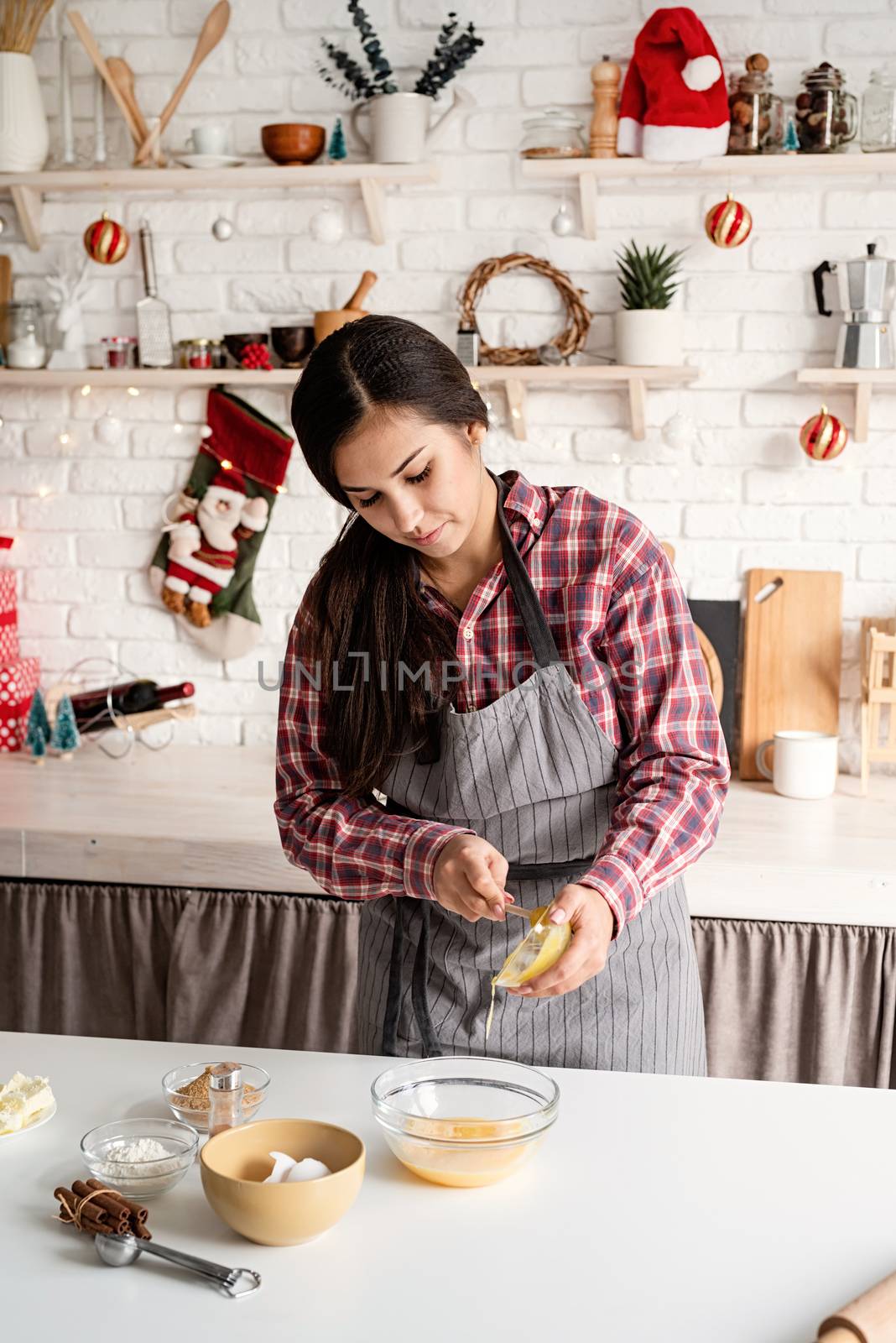 Cooking and baking. Young latin woman pouring the honey to the dough cooking at the kitchen