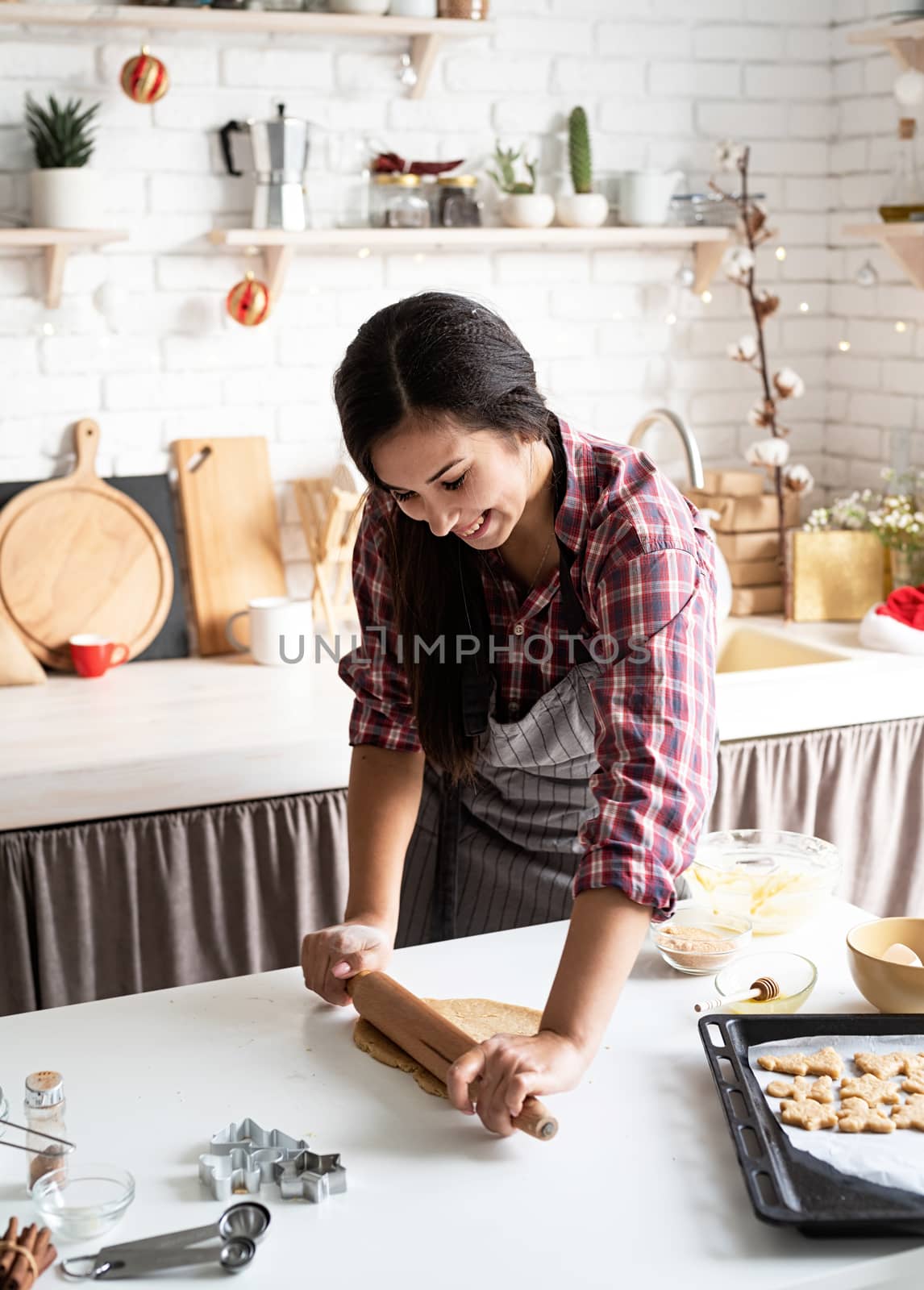 woman hands kneading dough at the kitchen by Desperada