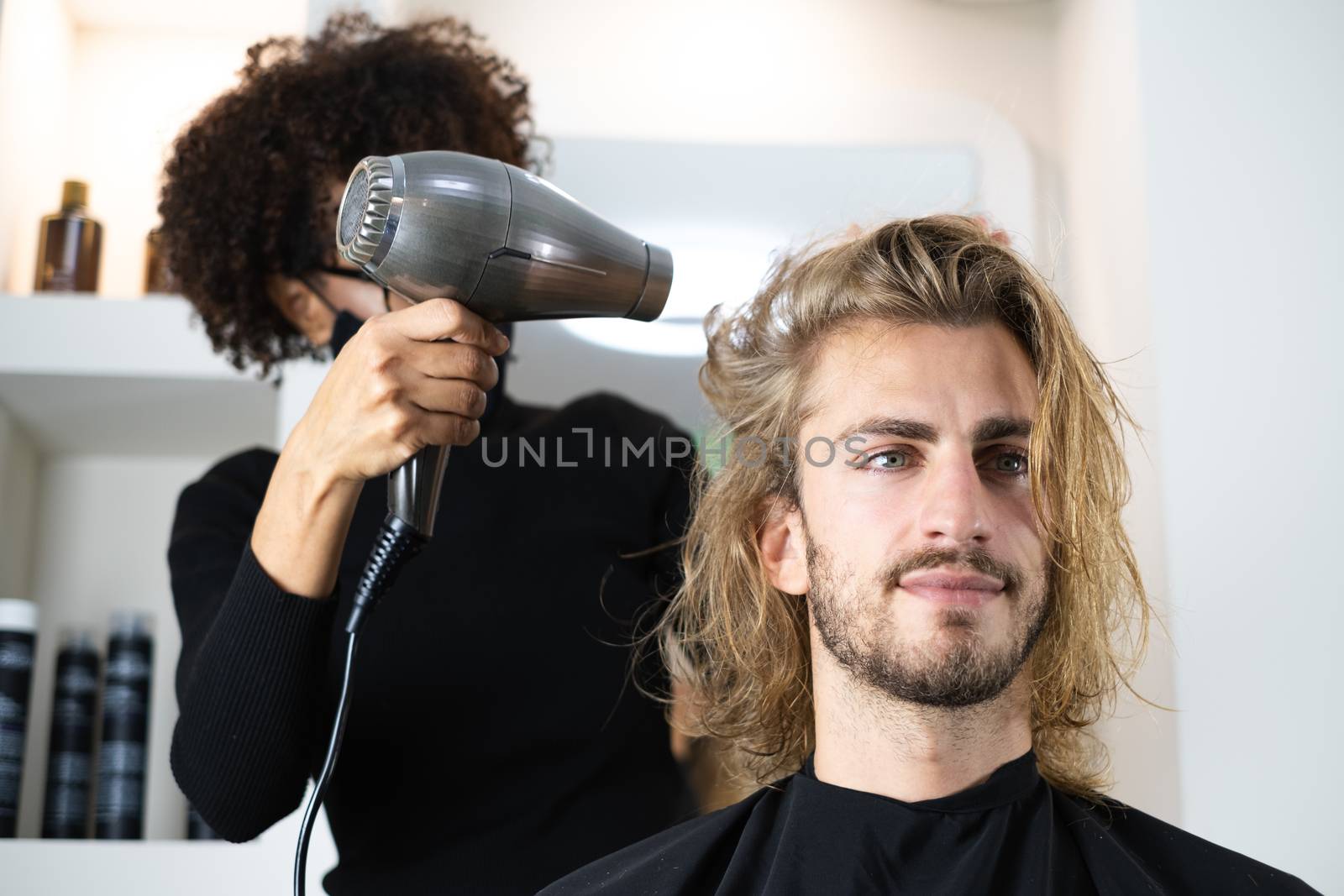 Male client getting haircut by black hairdresser by Dumblinfilms