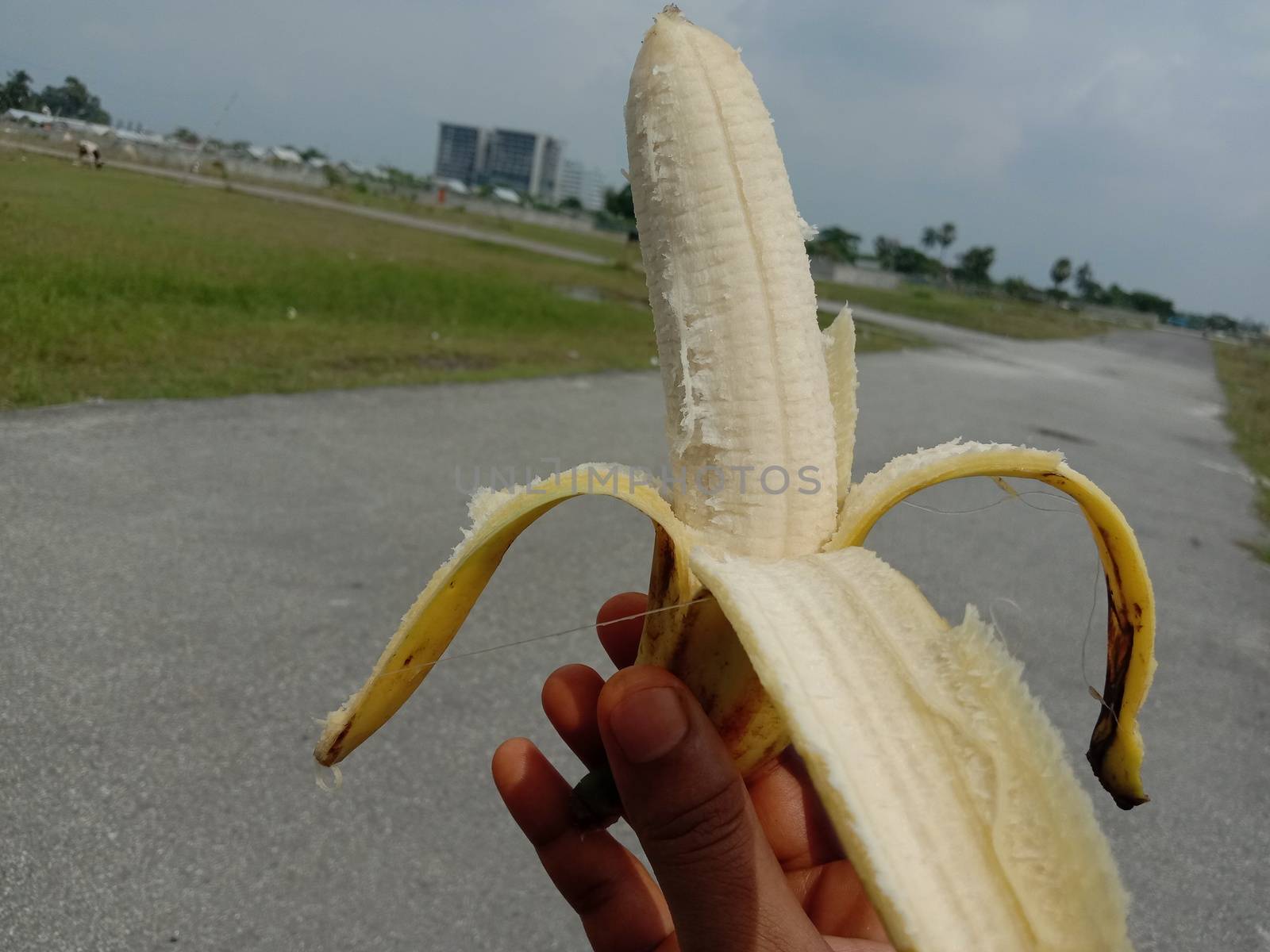 tasty and healthy expanded banana closeup on hand