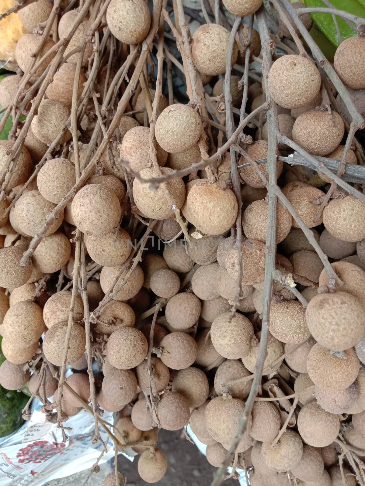 Tasty and Healthy Longan Stock on Wooden Table