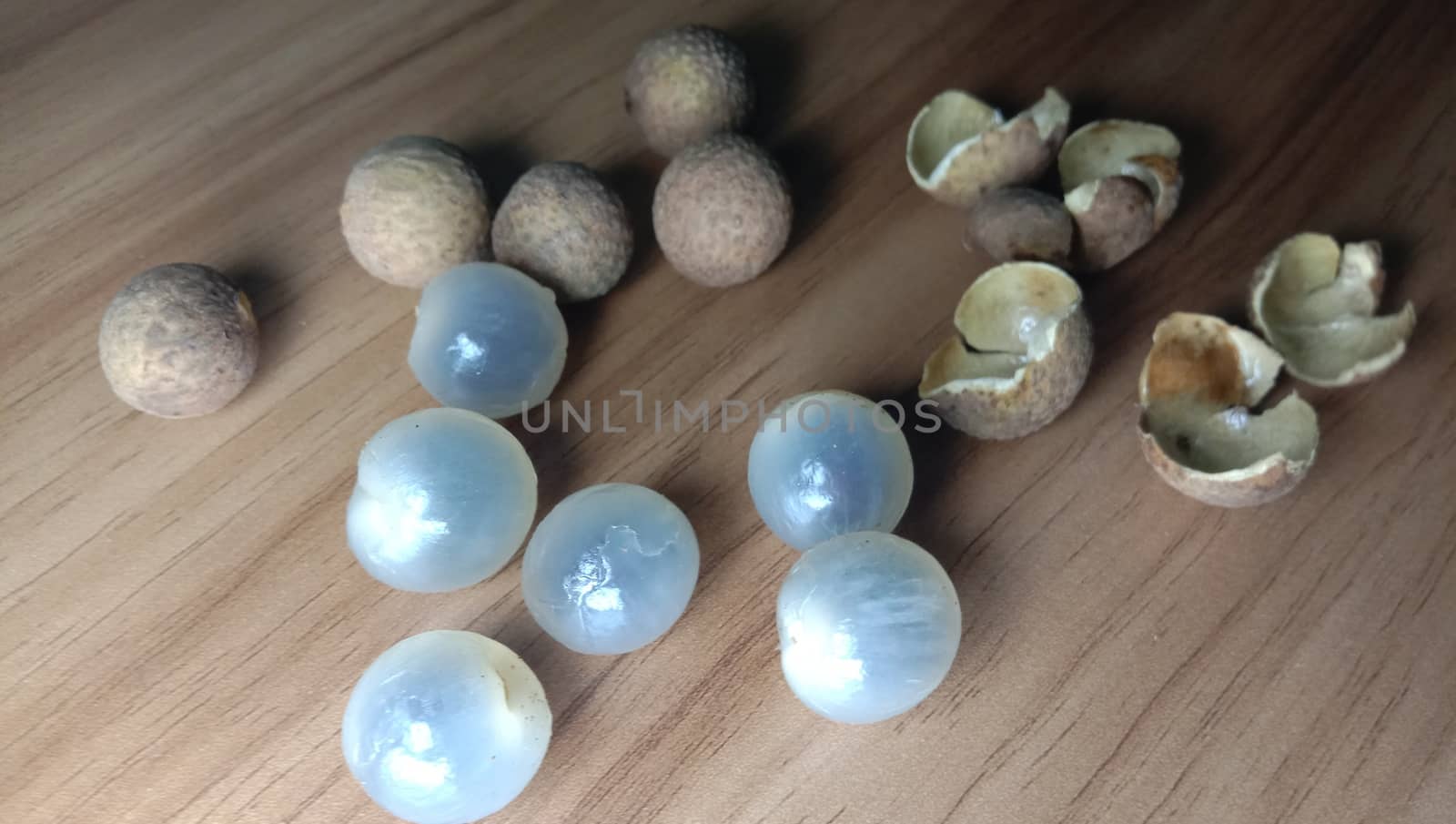 Tasty and Healthy Longan Stock on Wooden Table