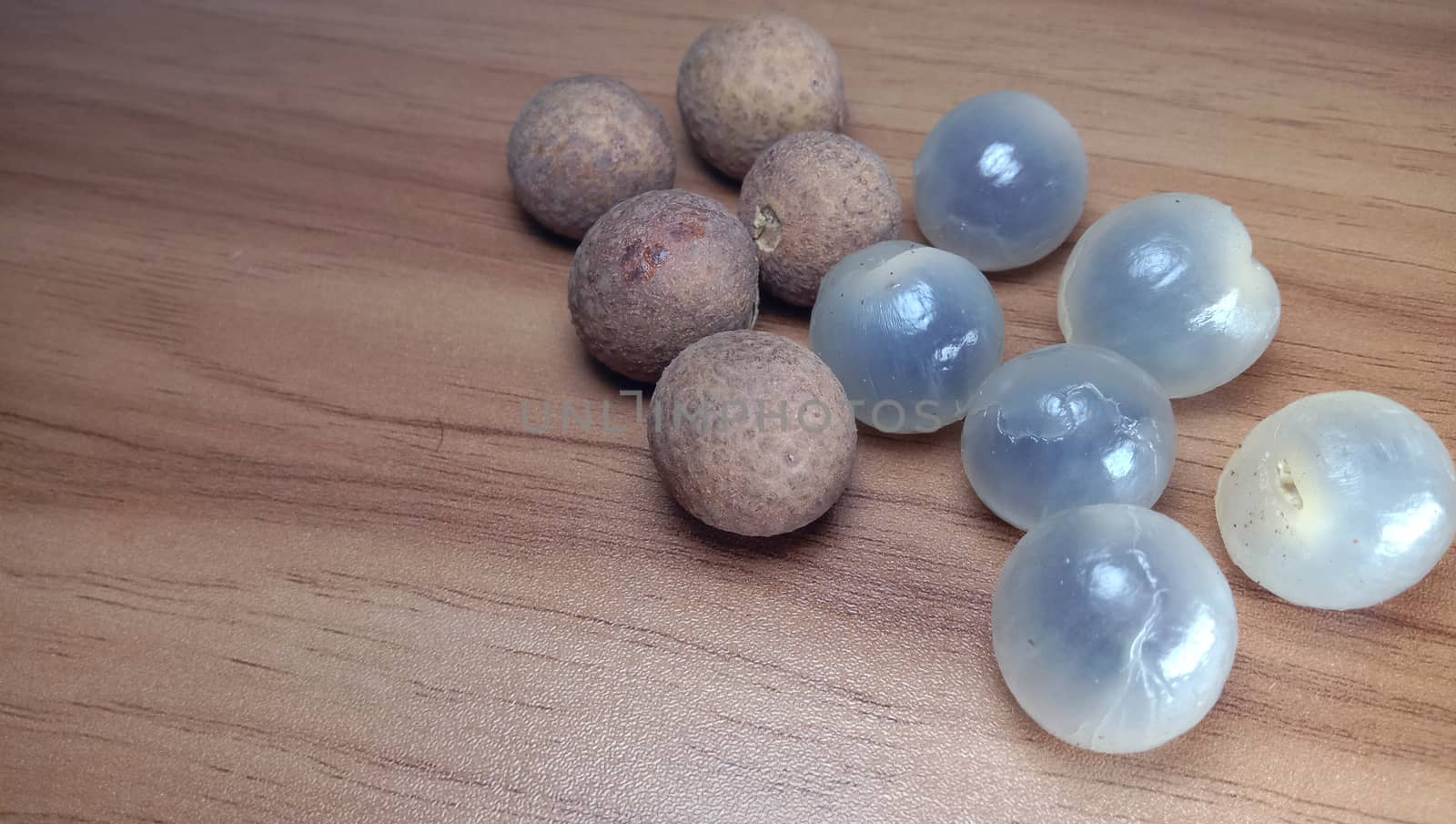 Tasty and Healthy Longan Stock on Wooden Table