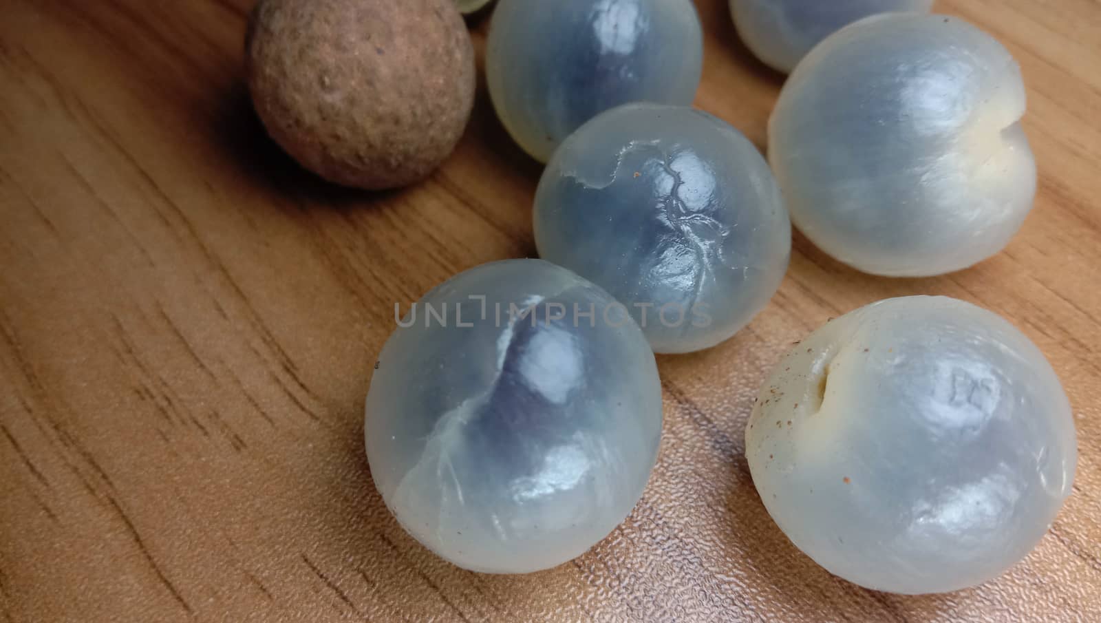 Tasty and Healthy Longan Stock on Wooden Table