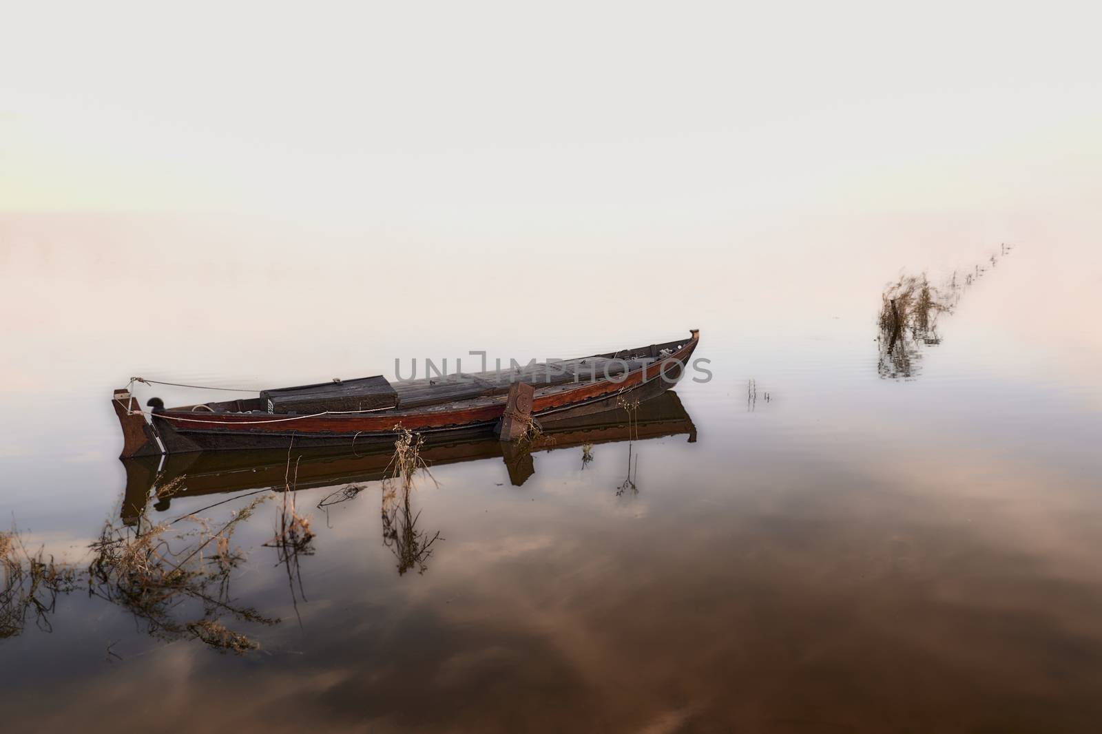 Small fishing boat on the lake by raul_ruiz