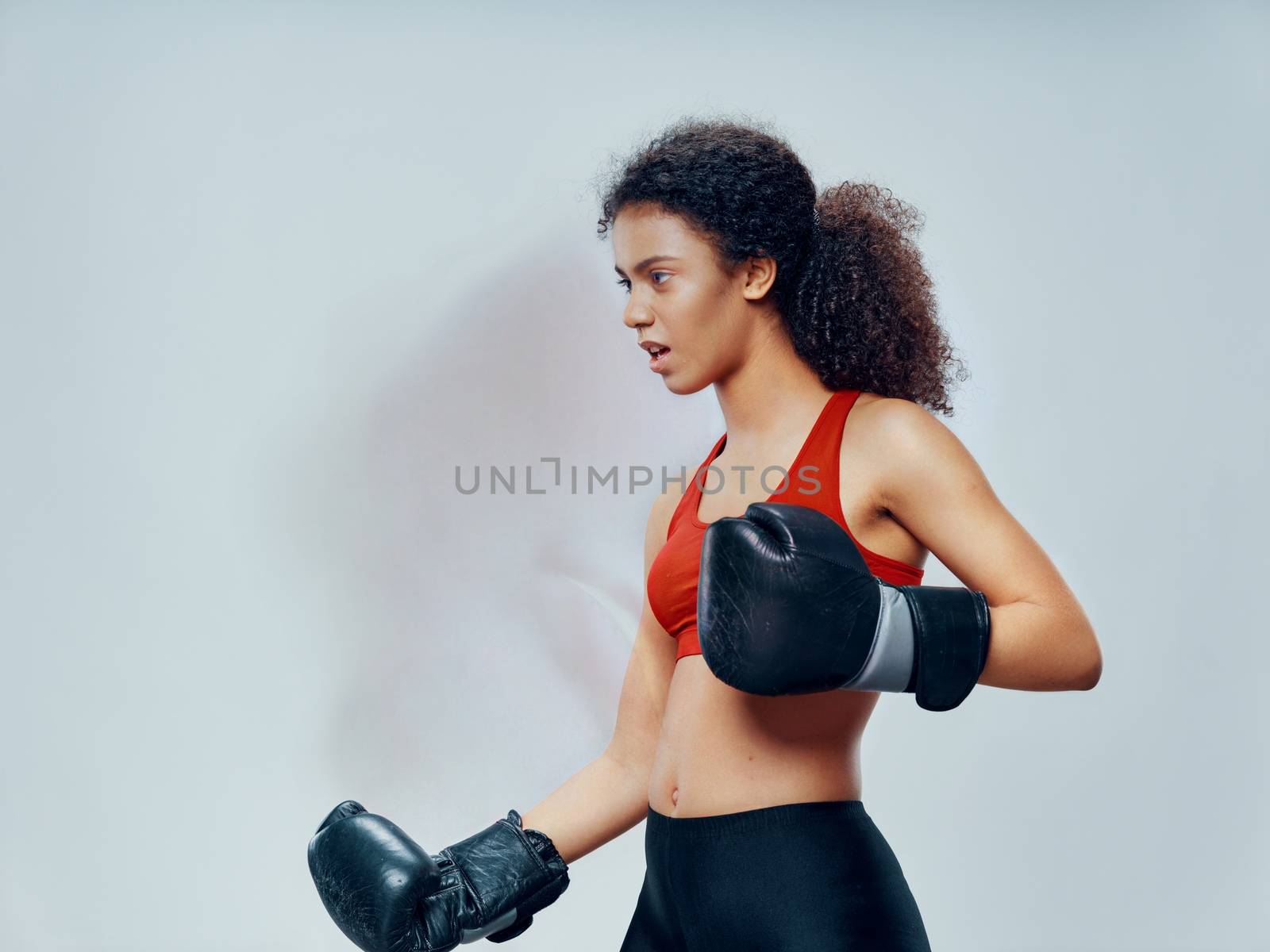 Sporty woman slim figure boxing gloves workout motivation kick