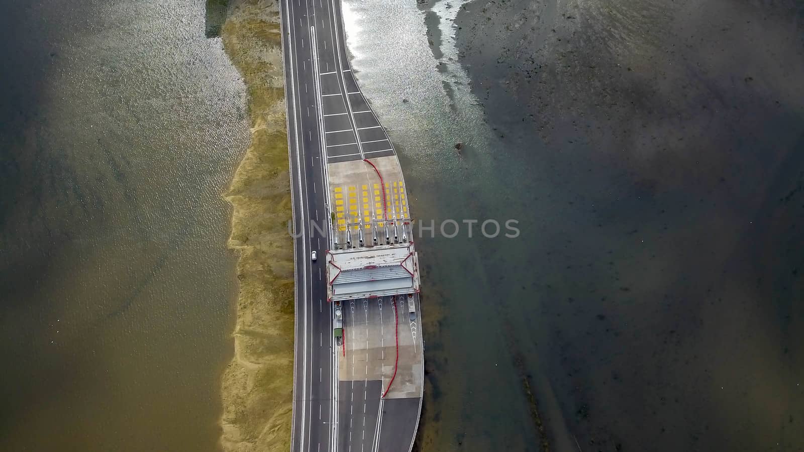 Aerial view to toll gate. Bali Mandara Gate. The reason behind it construction was to prevent traffic jams on the Ngurah Rai By Pass Road. The Bali Mandara Toll Road was built over water by Sanatana2008