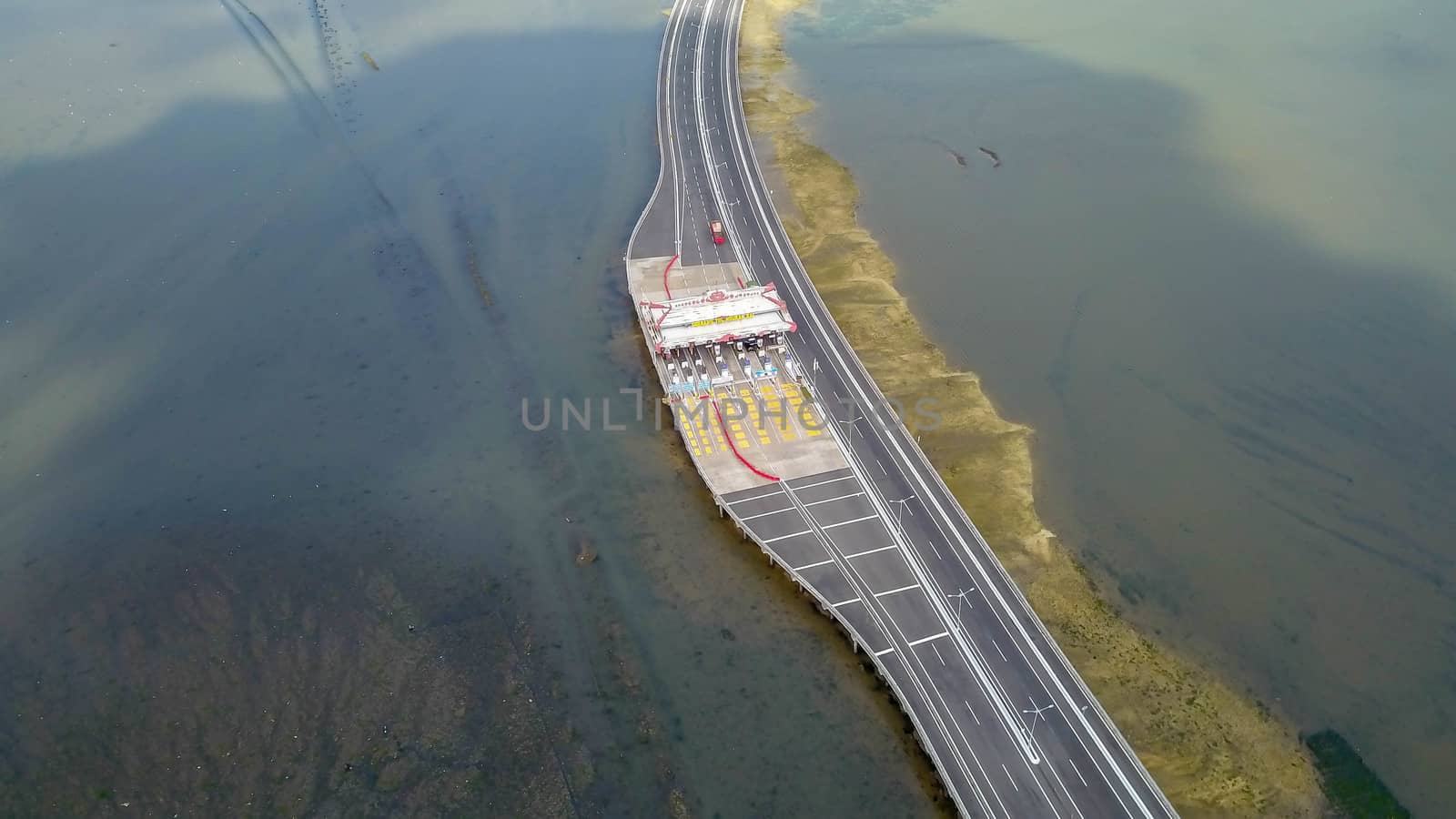 High Quality Aerial Highway Sea from Above. The toll gate of Bali Tollway.