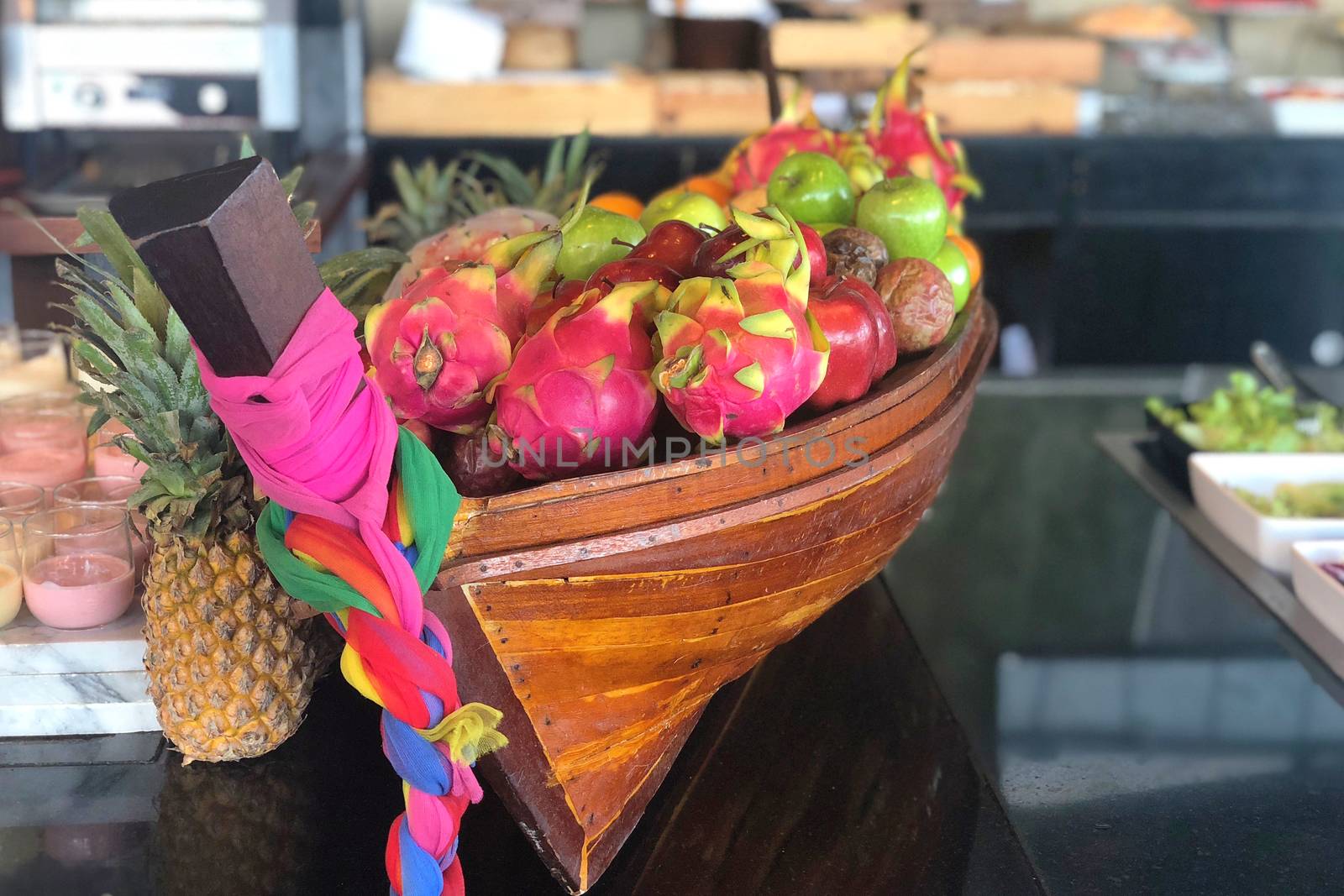 Tropical fruits in boat-shape basket in Thailand  by Surasak