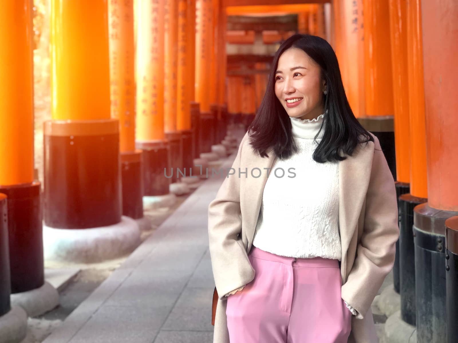  Young woman tourist travel Kyoto, Japan at Fushimi Inari Shrine by Surasak