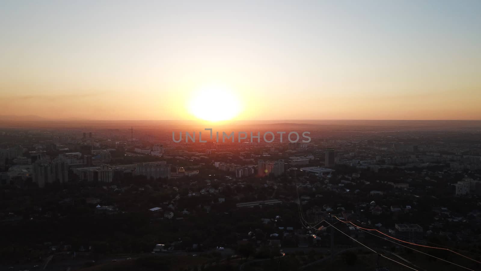 Red sunset over the city of Almaty. by Passcal