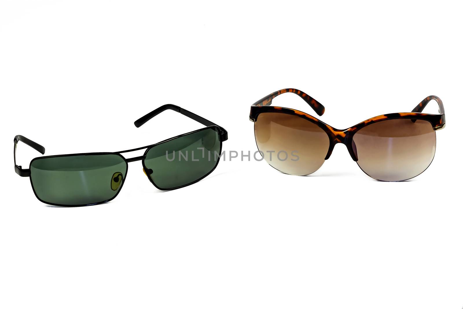Male and female glasses from the sun on a light background