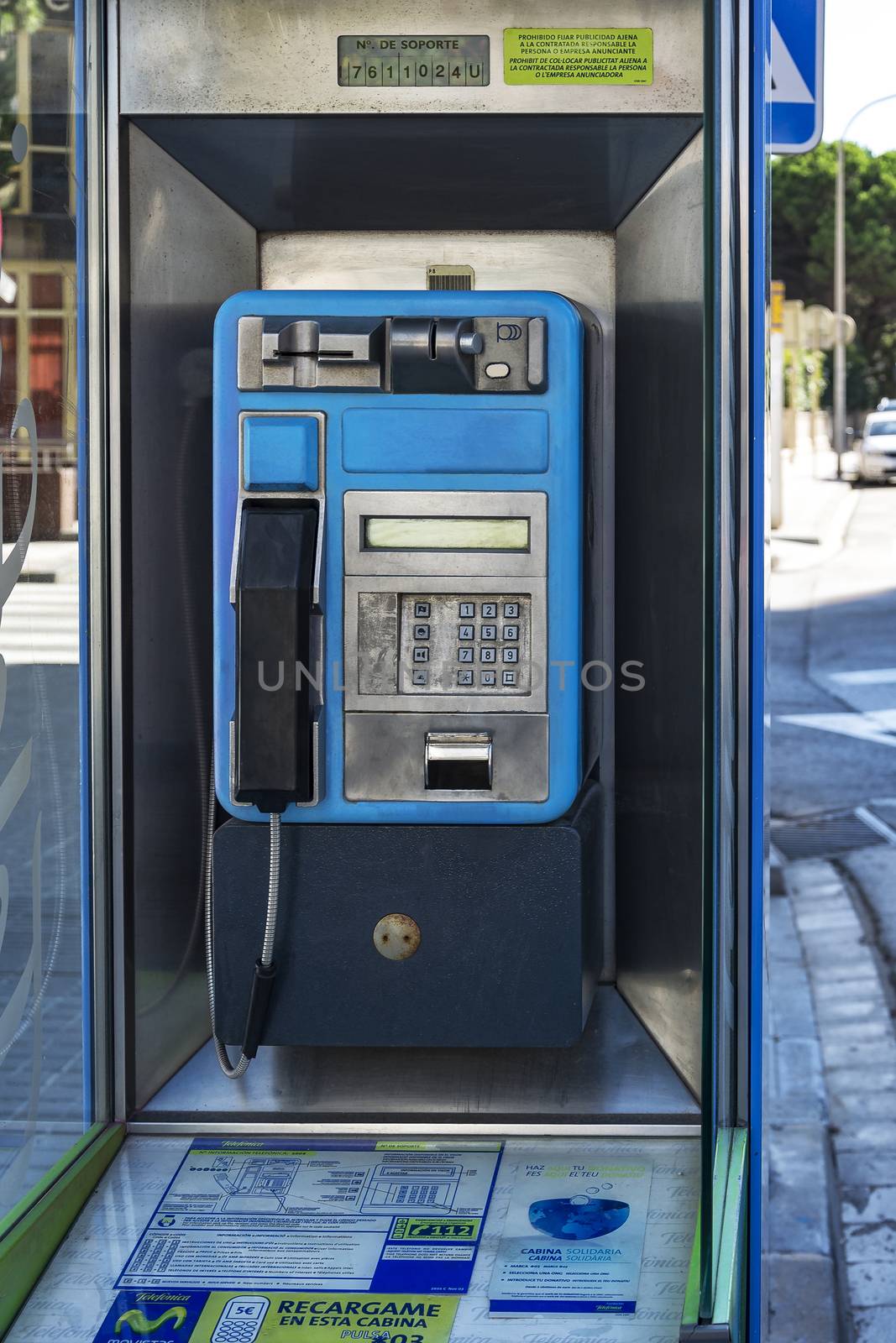 Spain, Blanes - 09/20/2012: Booth with payphone for city and long-distance calls