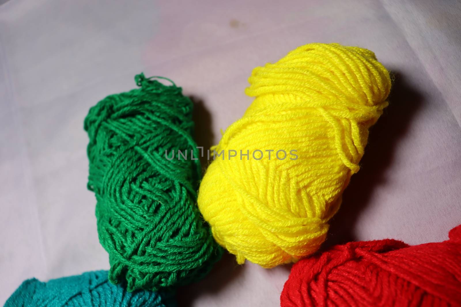 multiple colored yarn stock on white background