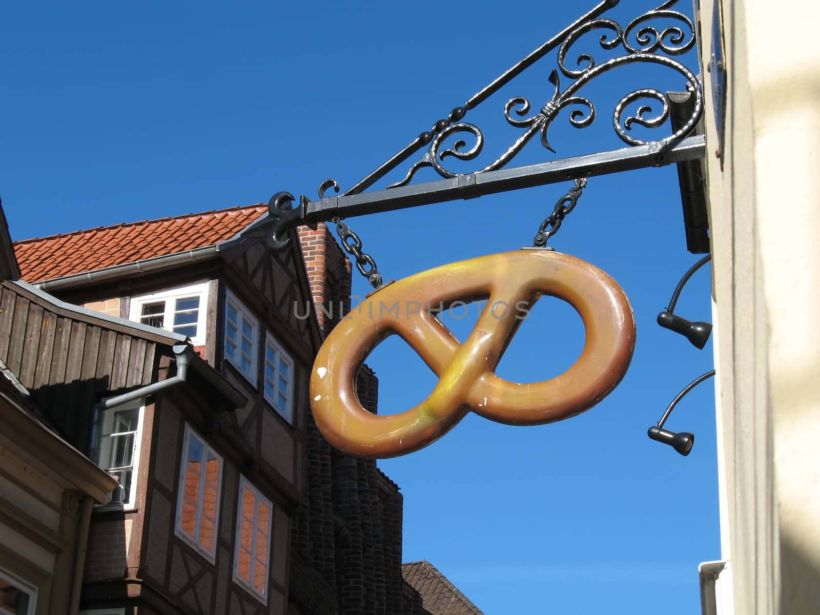 Bakery sign in form of a pretzel seen in Lueneburg, Lower Saxony, Germany.