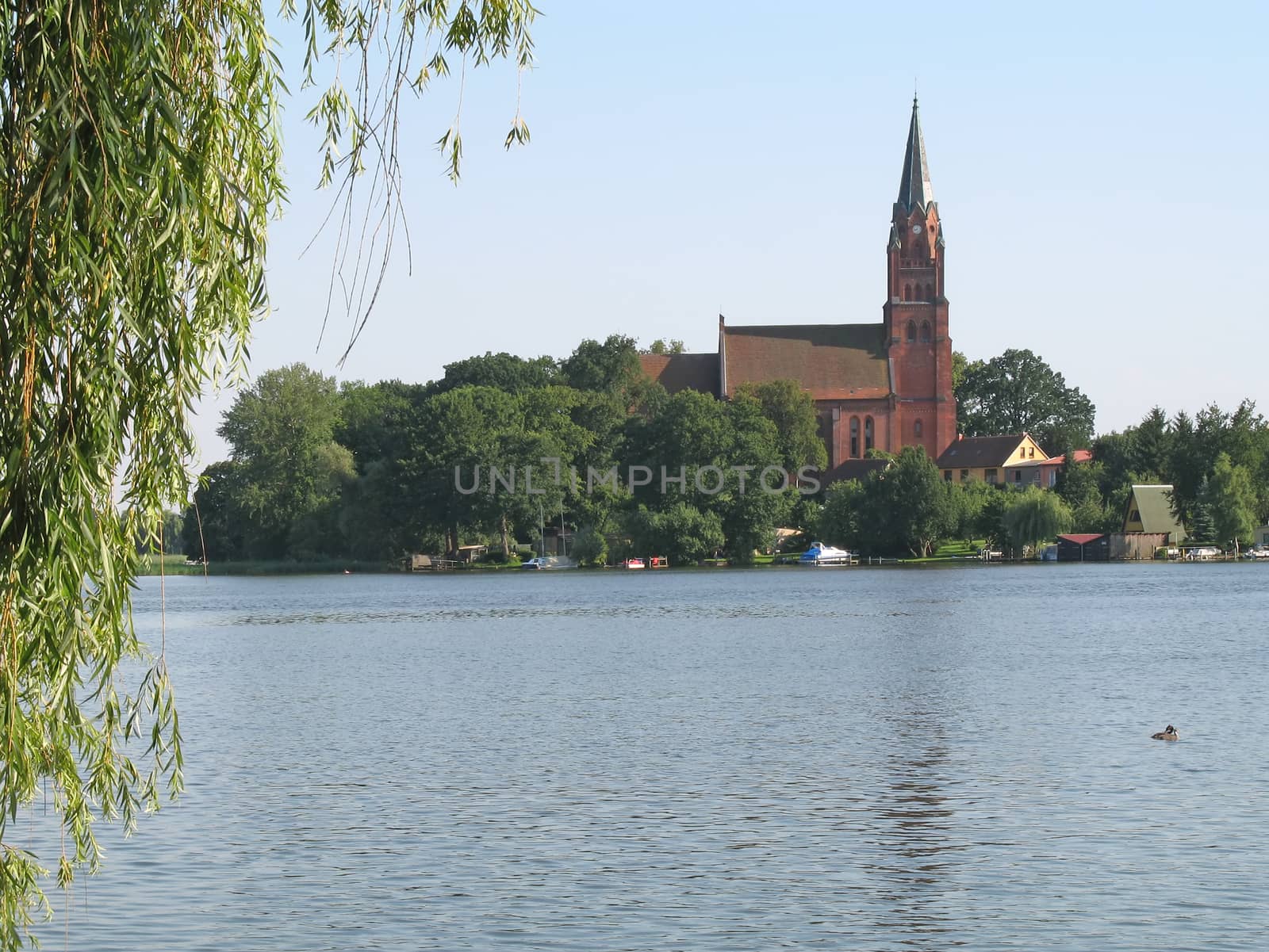 View onto the lake Mueritz and St. Marien Church in Roebel, Mecklenburg-Western Pomerania, Germany.