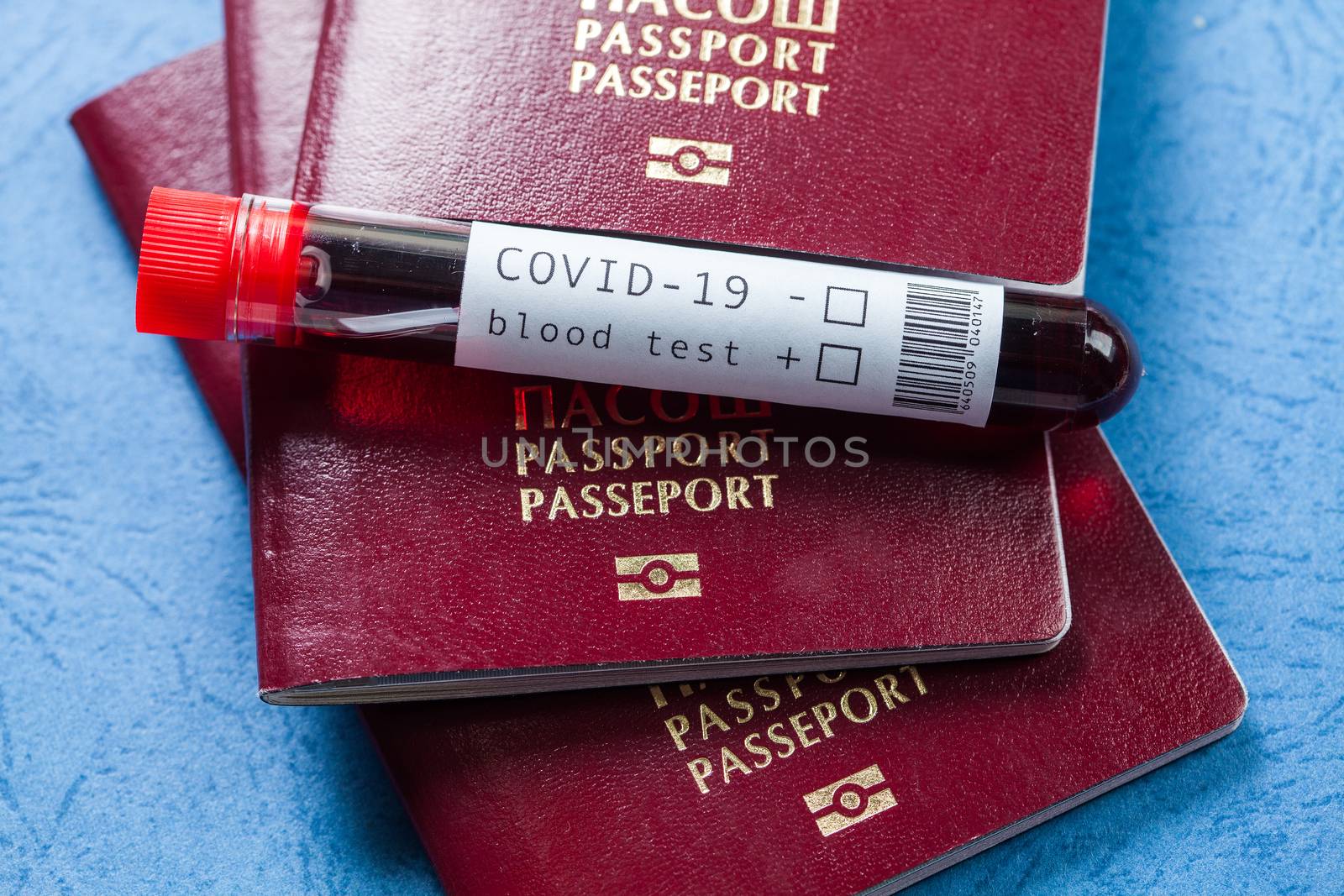 Several passports and test tube with blood sample by Plyushkin