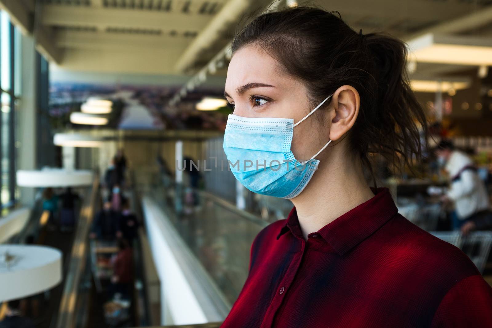 Beautiful pretty worried caucasian young woman wearing protectiv by Plyushkin