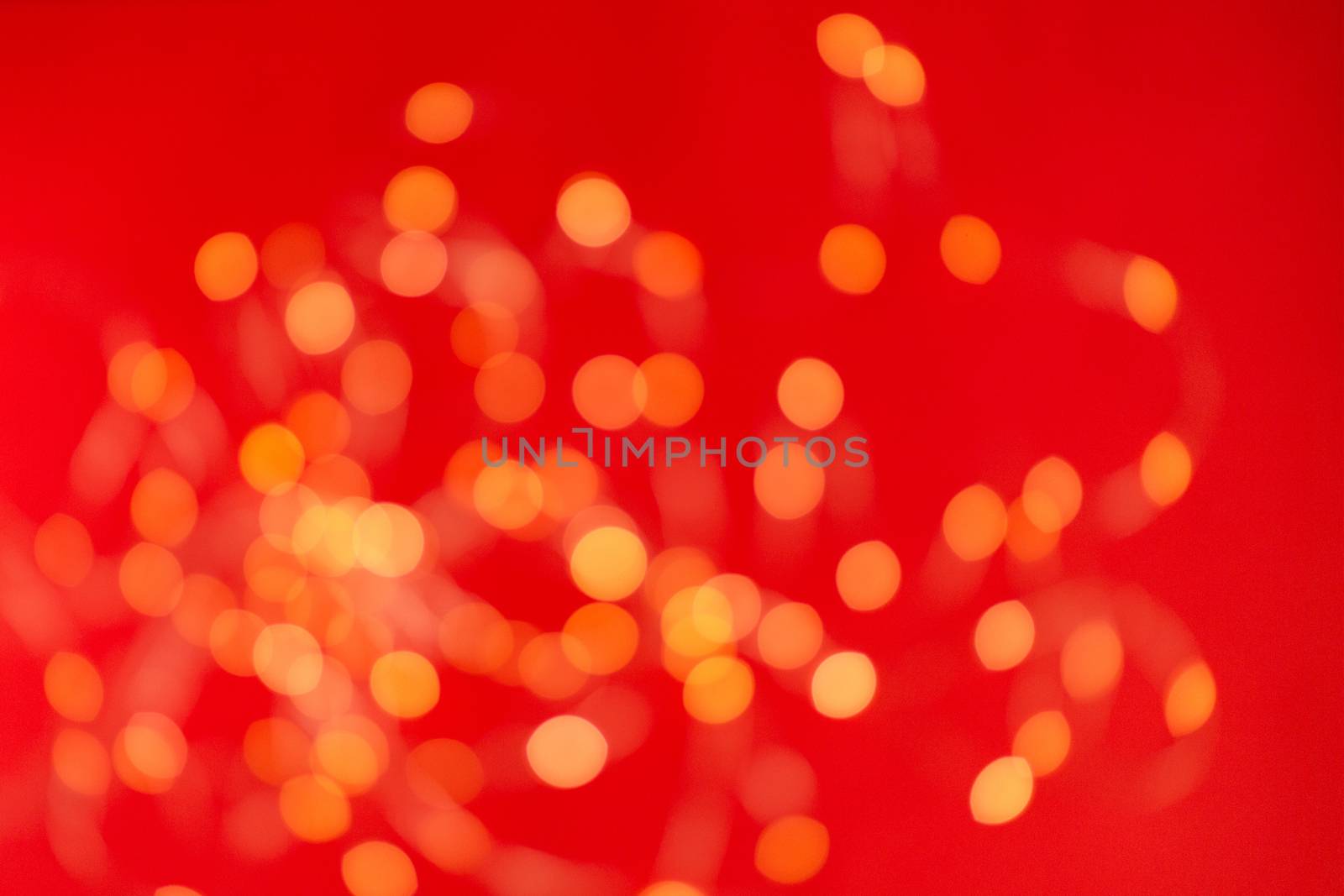 Christmas holiday background with festive bokeh on red background. Ready-to-install products. blur and bokeh. holiday blur lights. copy space. space for text by Pirlik