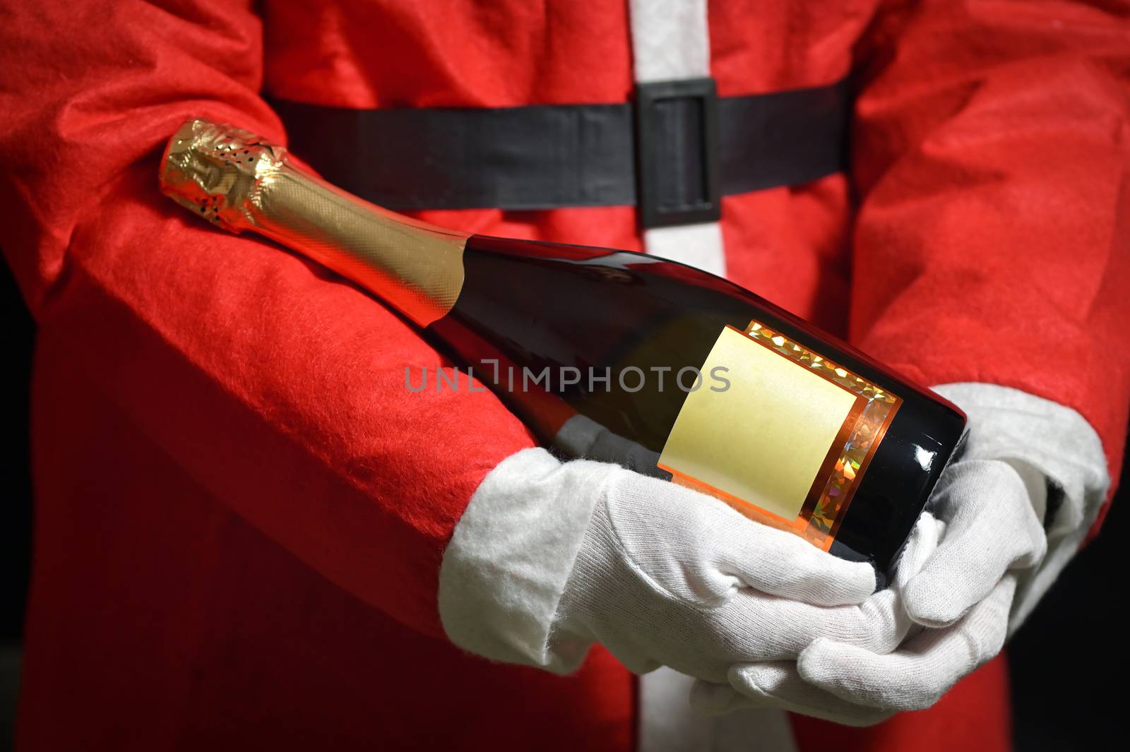 Conceptual Santa Claus Celebrating With Champagne Bottle