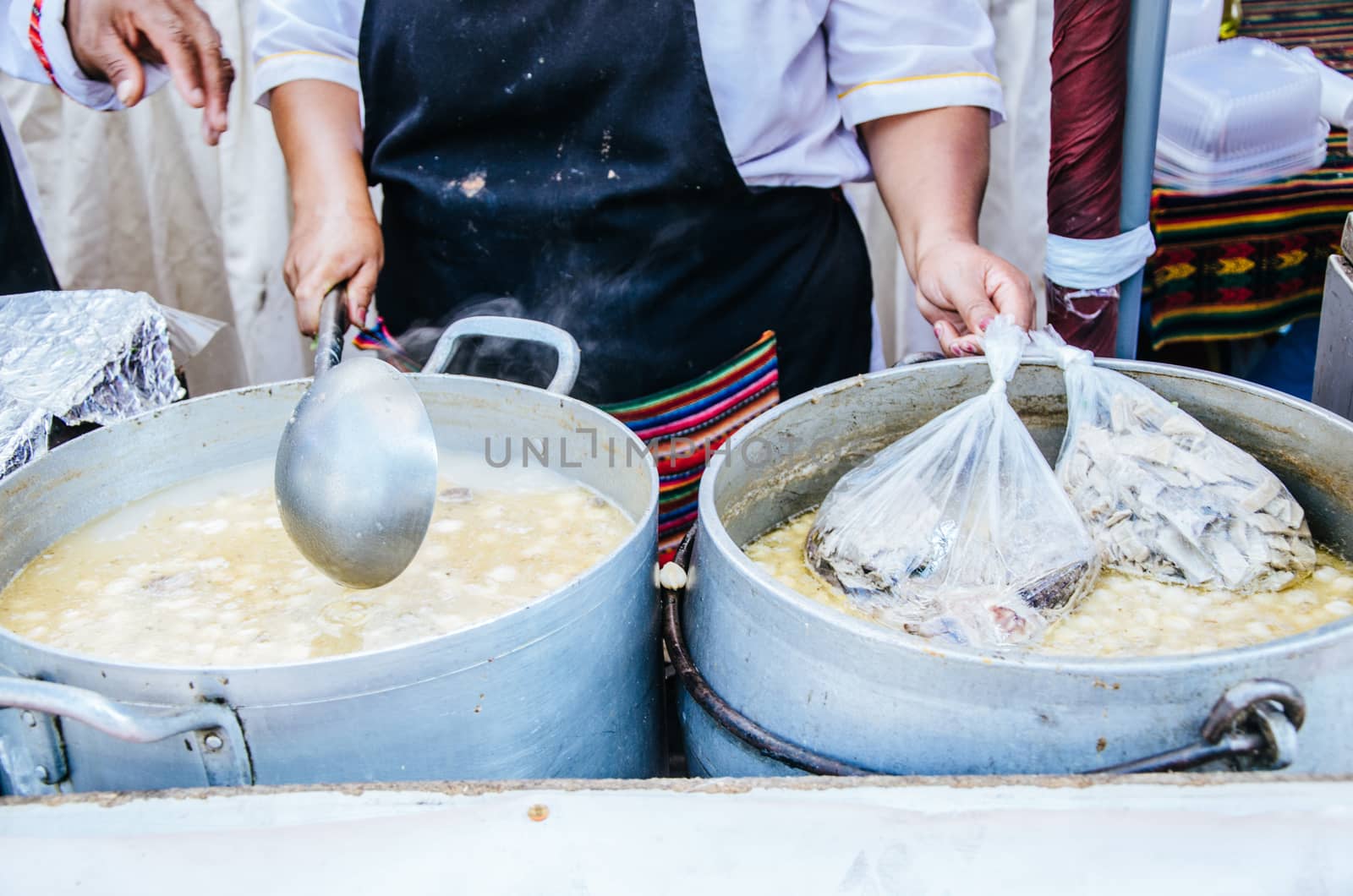 Peruvian food: Sopa criolla of caldo de mote in a large aluminum pot